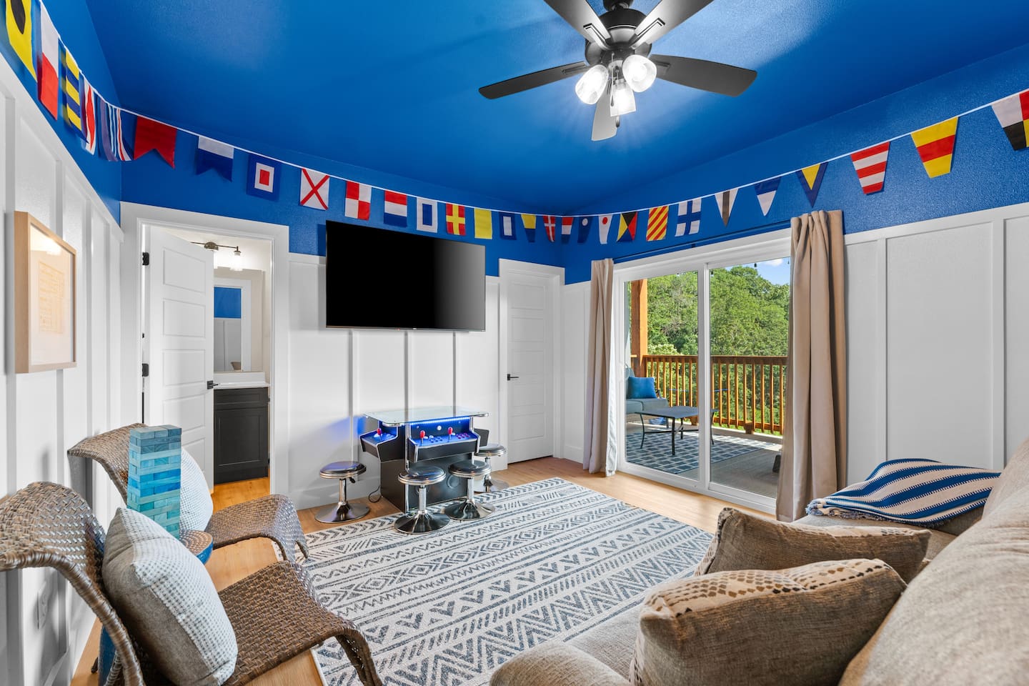 Private game lounge with retro arcade fun for kids, teens, and adults plus Queen sofa bed.