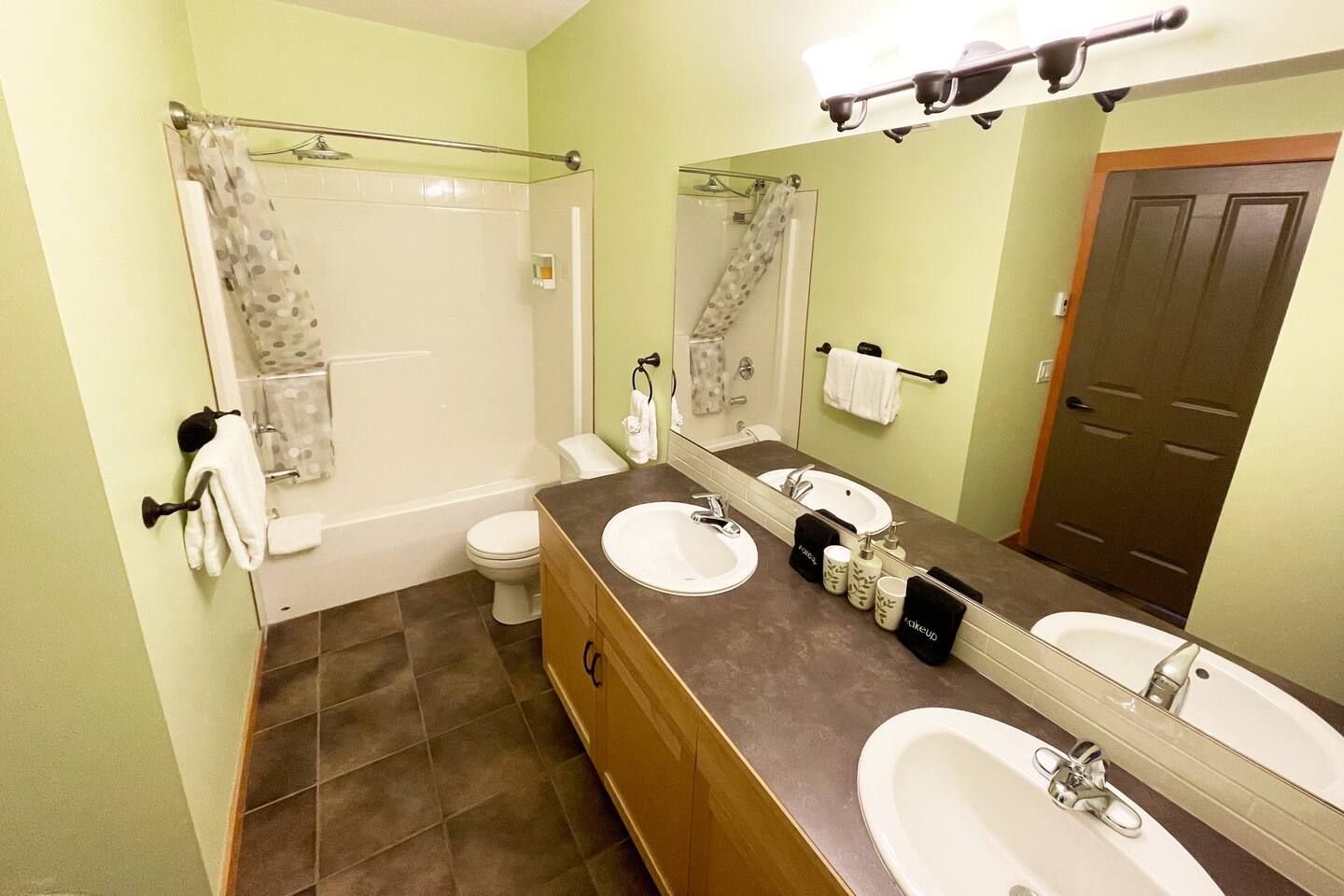 Master ensuite bathroom, with his and hers sink, shower, and tub.   Heated floor! 