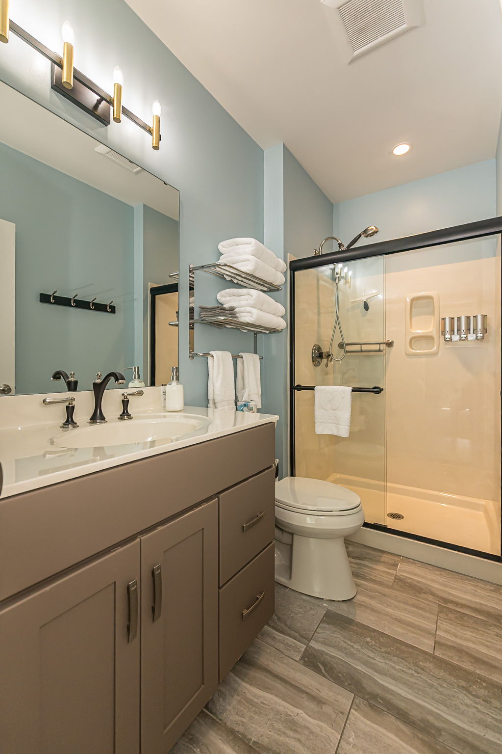 Bathroom 3 is attached to bedroom 3 and has a walk-in shower.