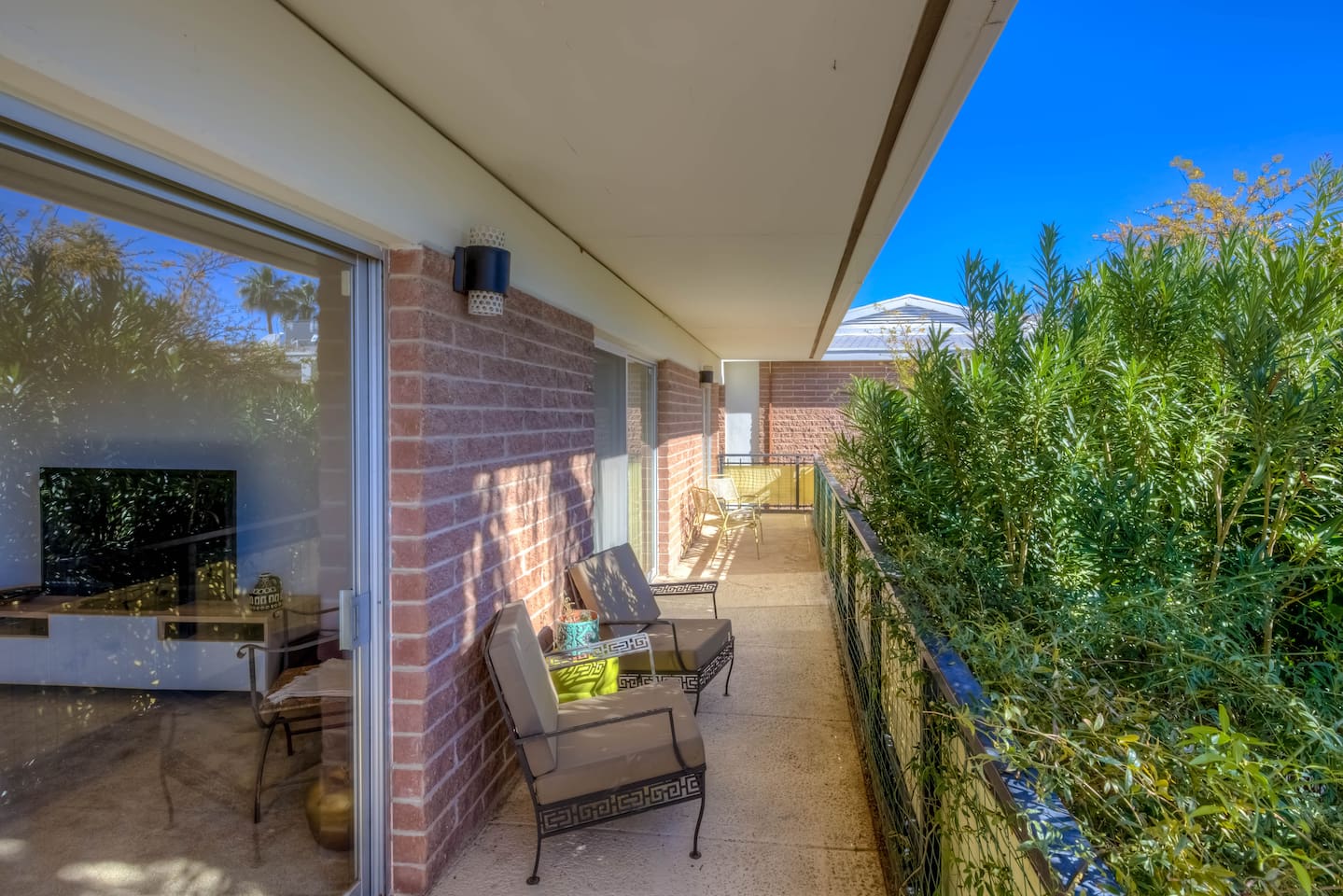 balcony off living room with outdoor seating