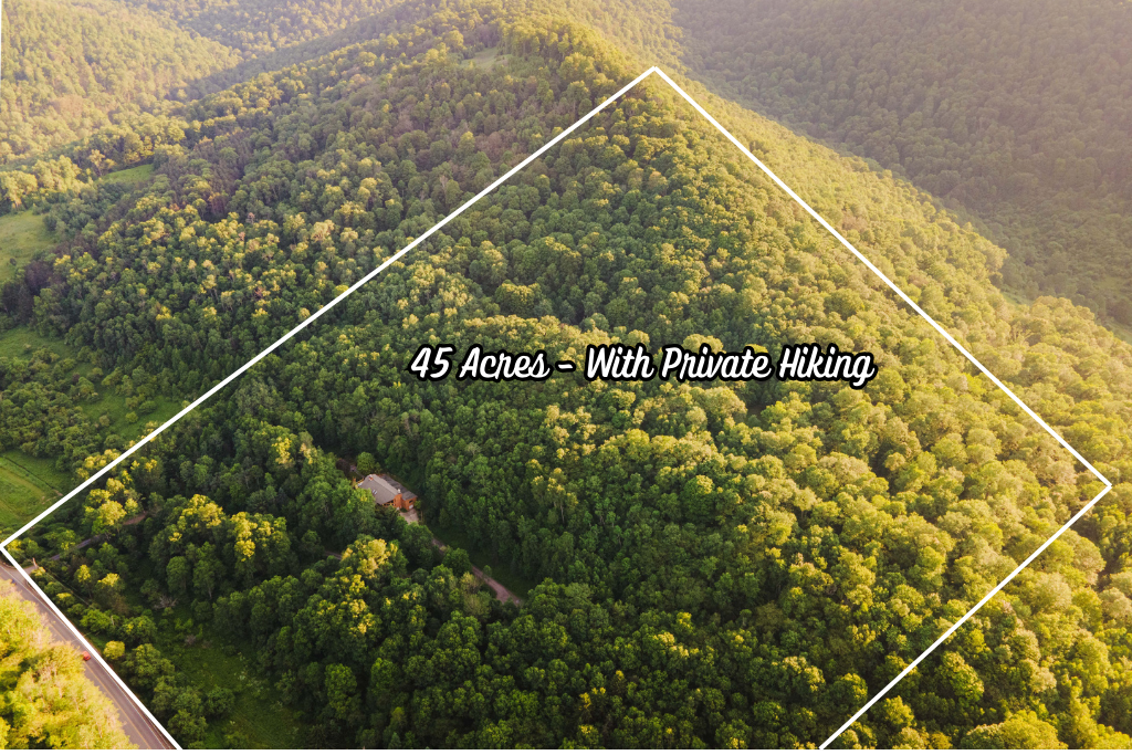 Nestled on 45 private acres, Cosmic Ridge Retreat offers your own secluded mountain escape — complete with private hiking trails, wooded ridgelines, and total peace and quiet.