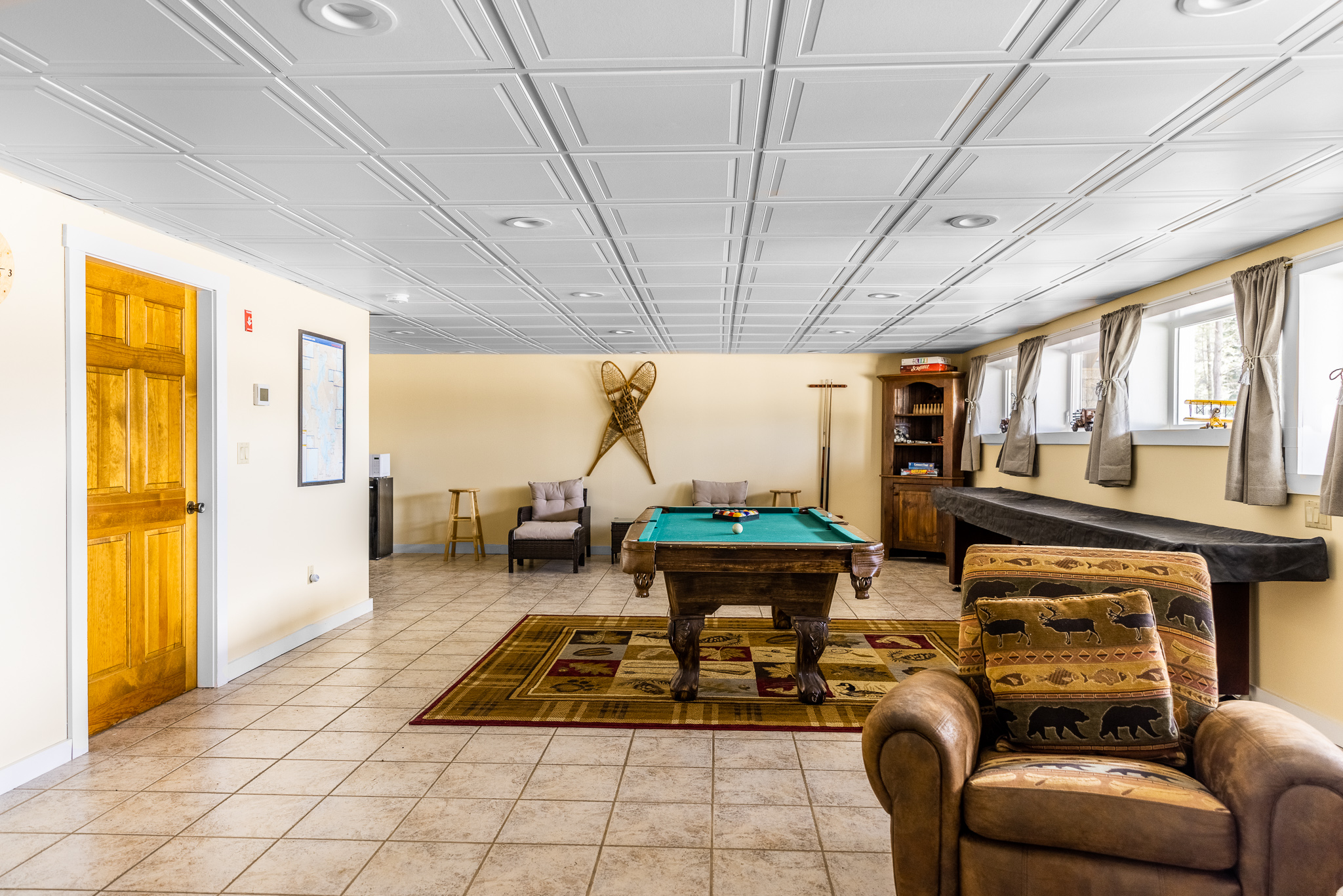 Game room: pool table, ping pong table, shuffleboard table, games, TV, sleeper sofa.