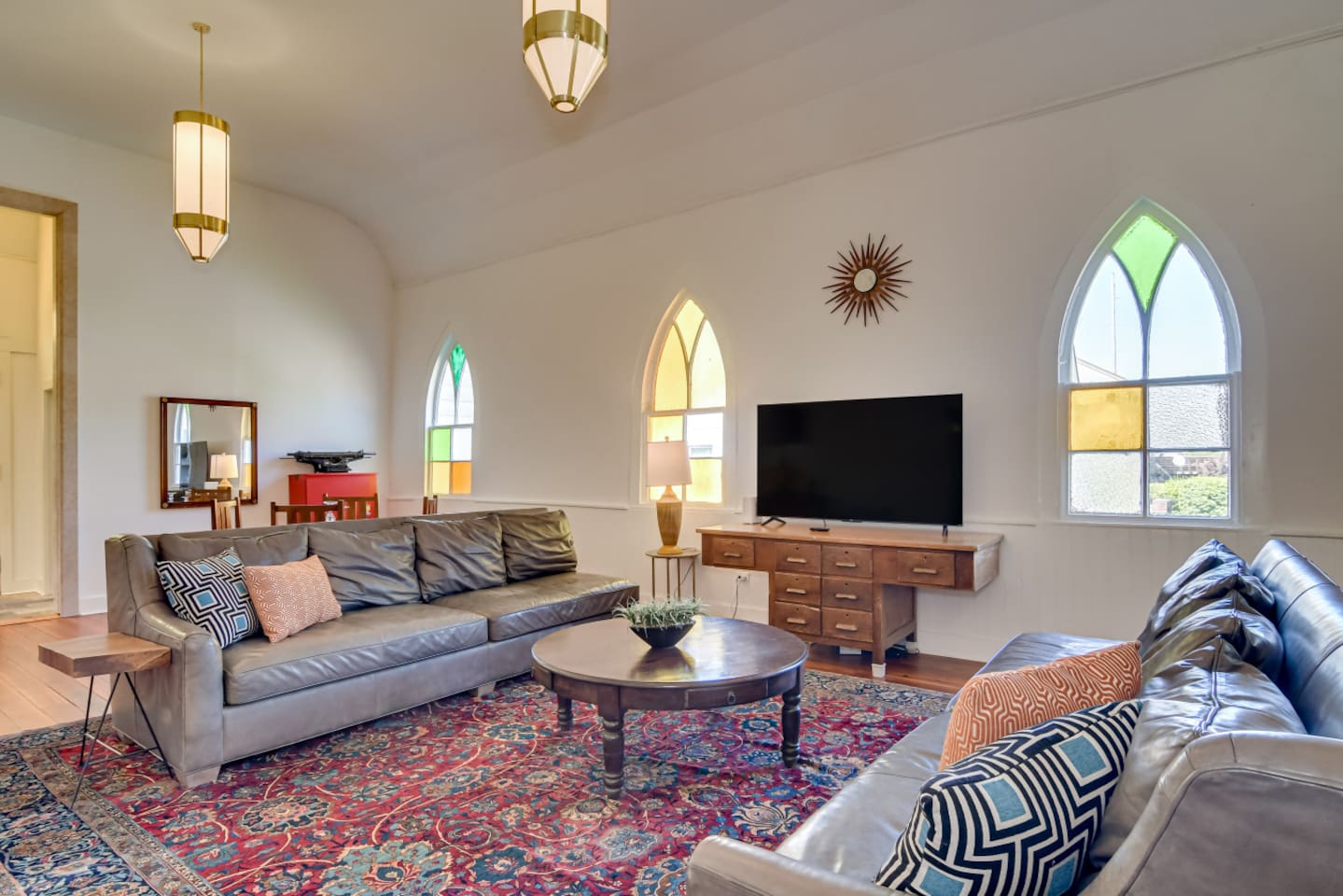 Living space with cathedral ceilings and comfortable sofas.