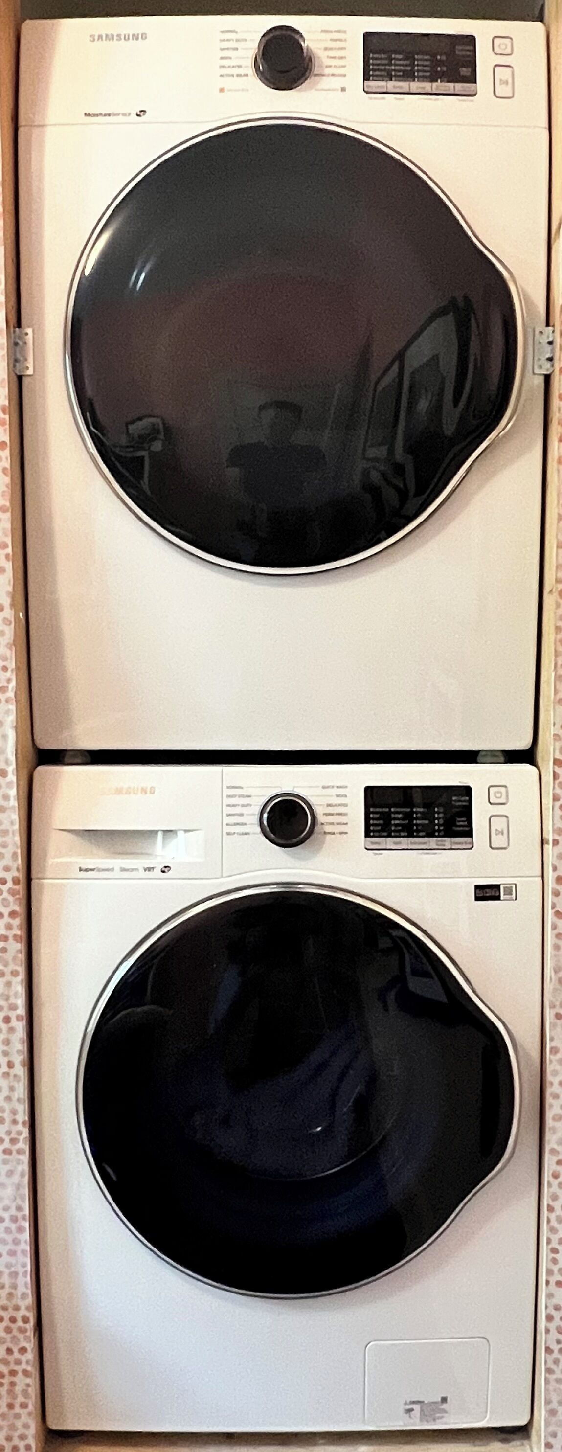 Samsung front-load washer and dryer on the 2nd floor—laundry made easy with detergent and supplies ready for guest use.