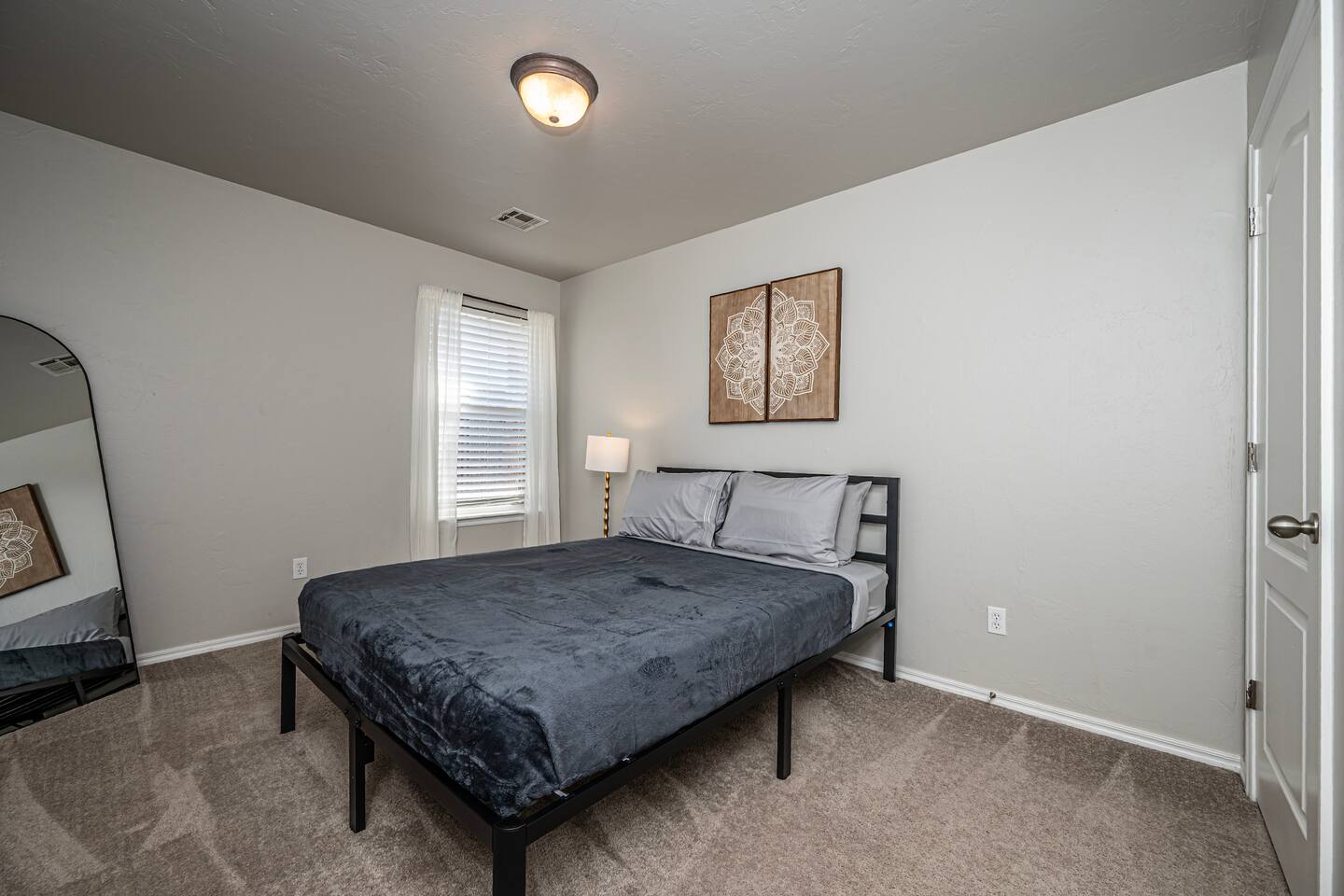 Secondary bedroom featuring a restful queen bed for a great night’s sleep.