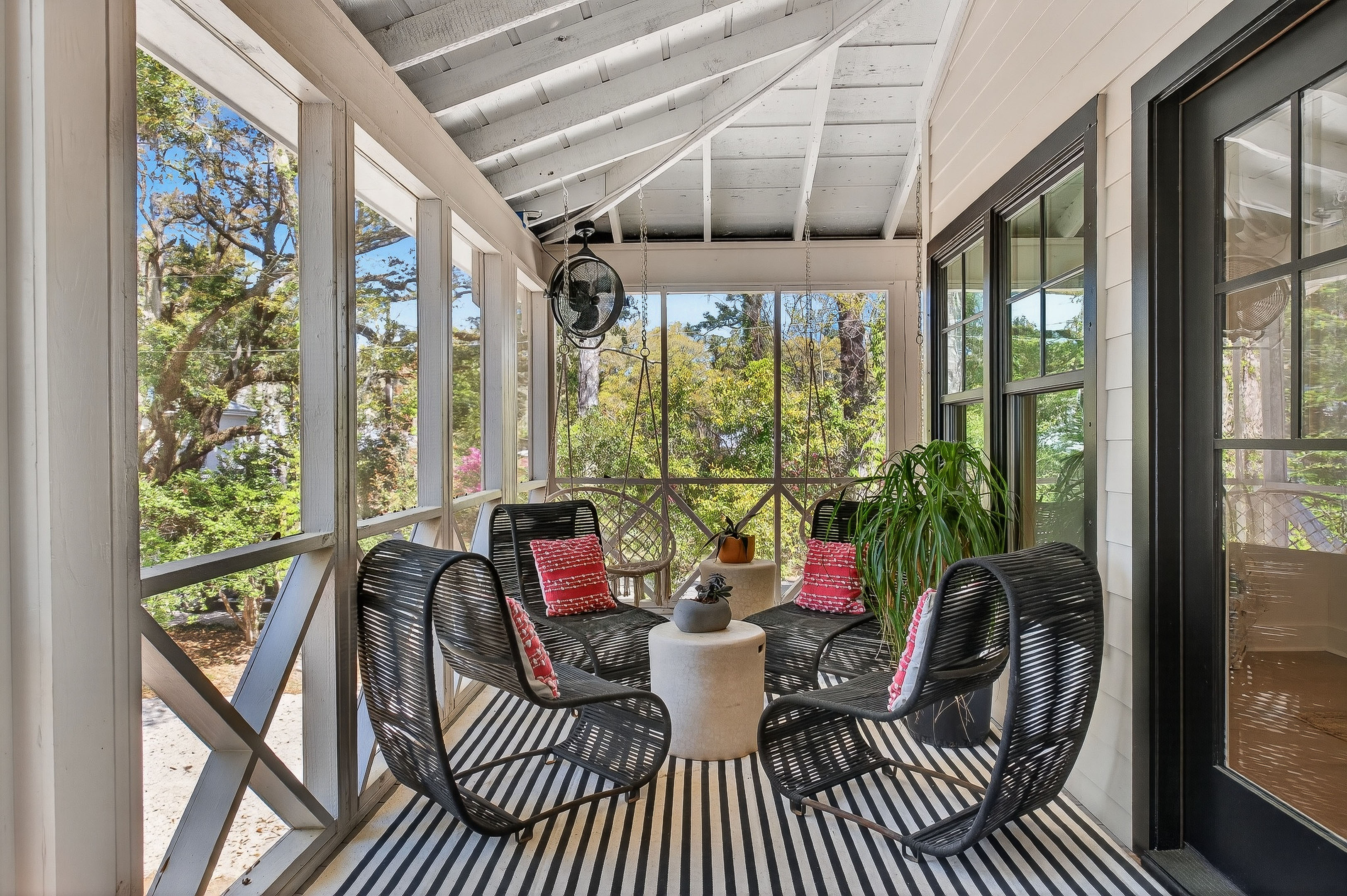Relaxed front entry screened porch—perfect for morning coffee or evening wine