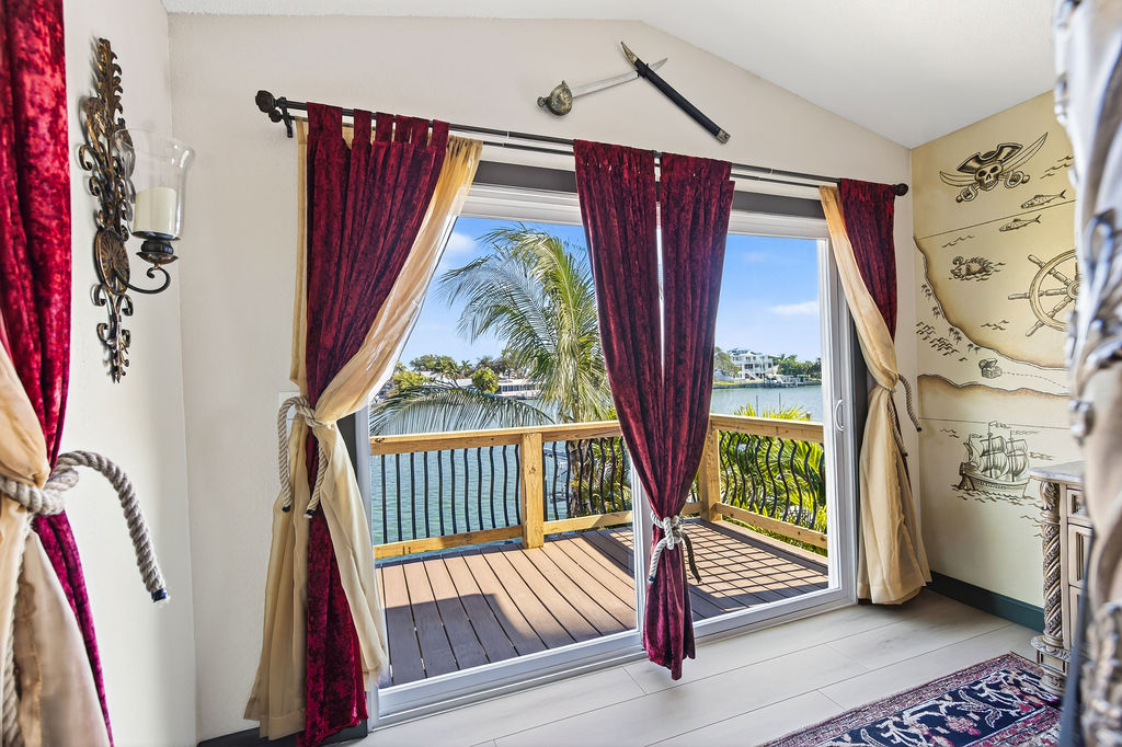Commodore’s Balcony – Command the horizon from your private perch. With the pool below and the ocean stretching endlessly beyond, it’s a view fit for plotting voyages, spotting treasure ships, or simply raising a glass as the sun sinks into the sea.