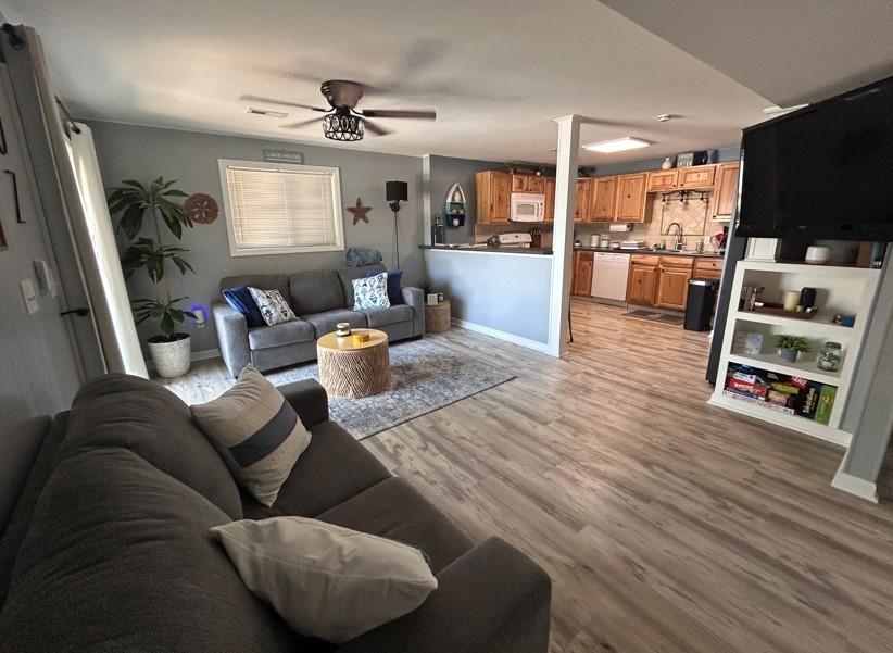 Open concept living room and kitchen with 2 walk-out options.