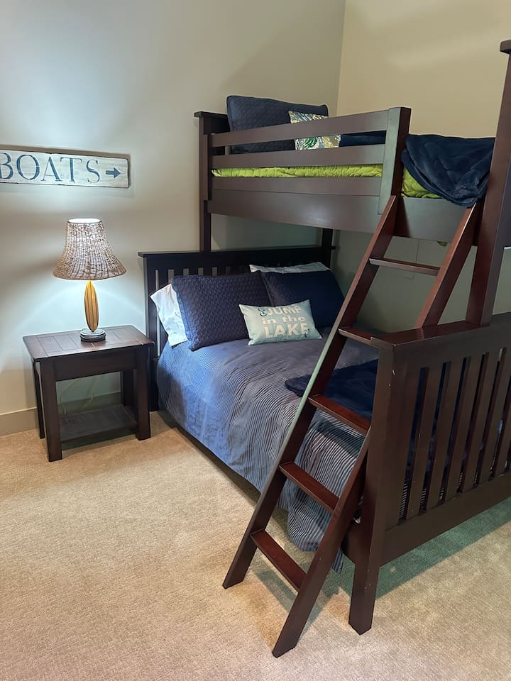 Full-over-twin bunk with ample storage, connected to the Jack and Jill bathroom.