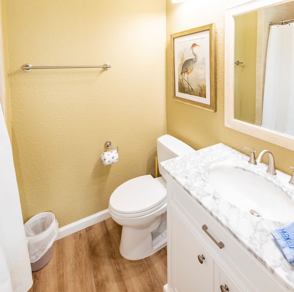 Your private ensuite: shower, vanity, tile floors &mdash; no waiting in line, no sharing. When both king suites have their own bath, everyone sleeps better.