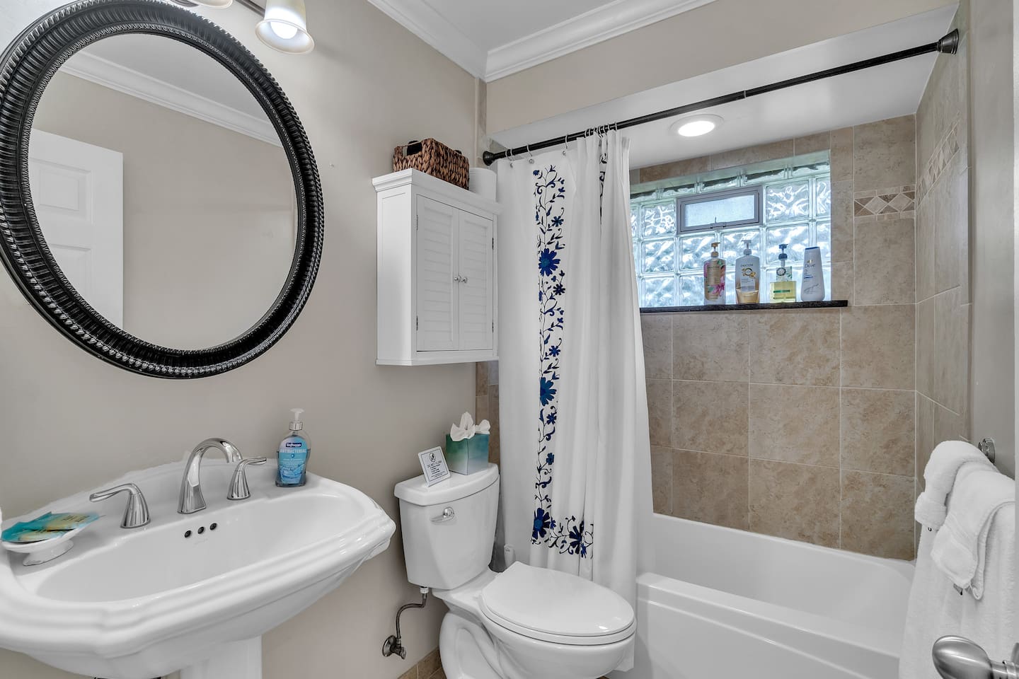 The inviting bathroom comes with a bathtub and a shower.