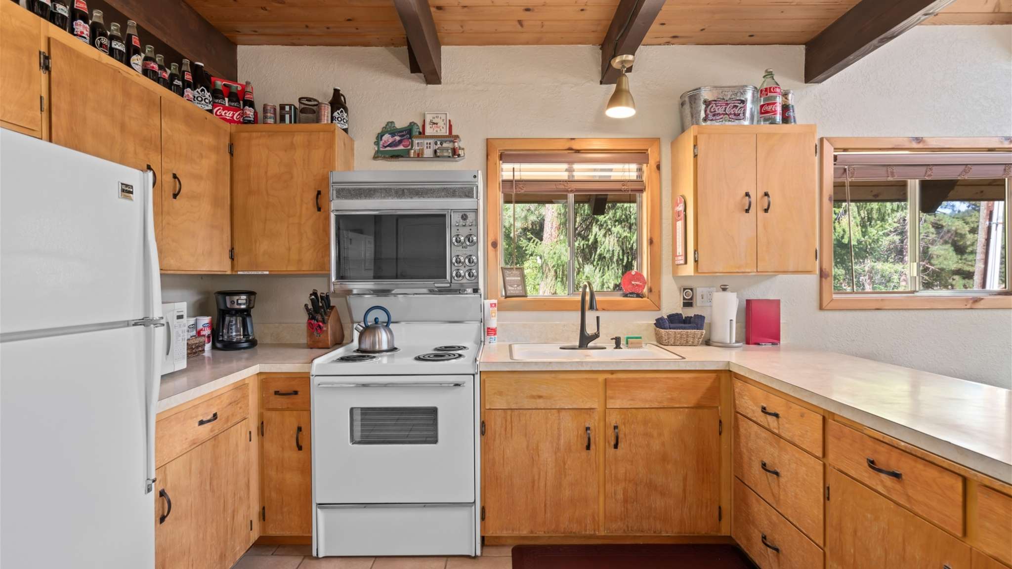 Private balcony overlooking the trees — the perfect morning coffee spot.