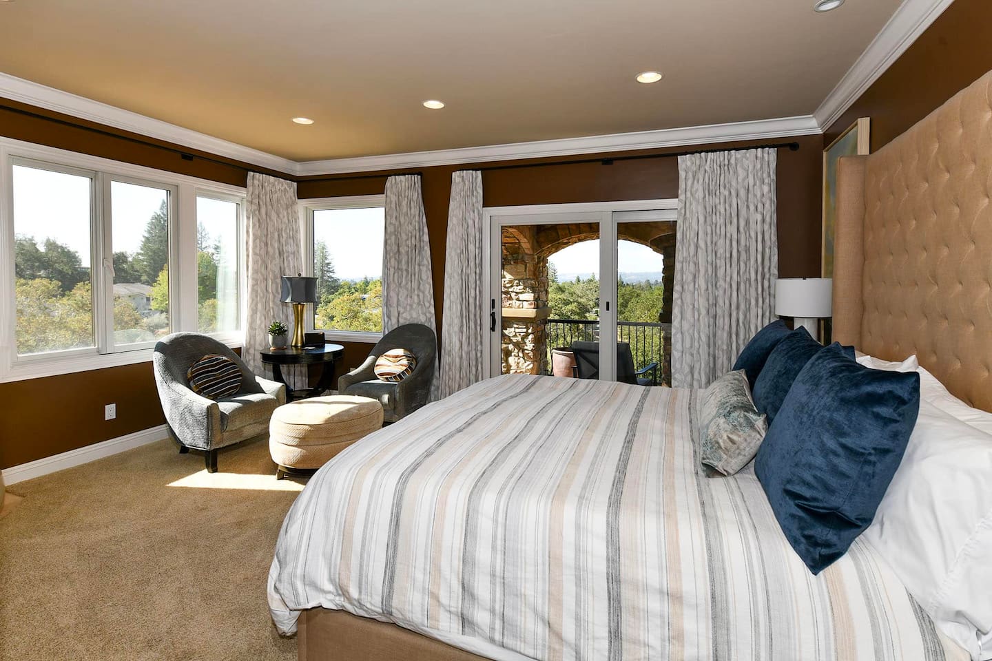 Primary bedroom with king bed,  fireplace, and smart tv.