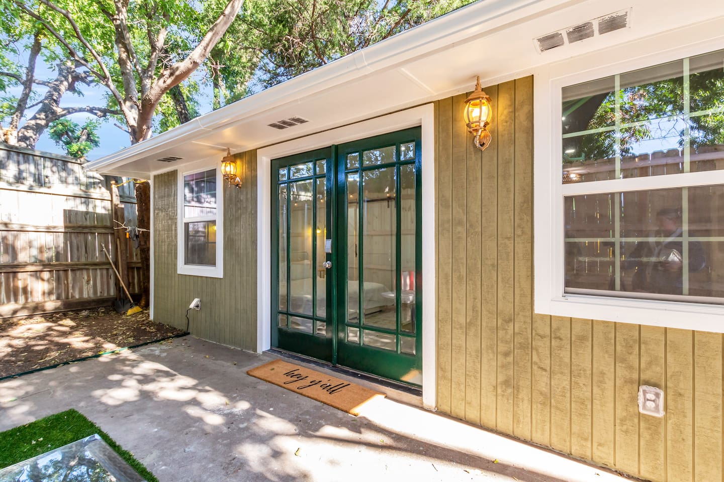 Enjoy your own private entry via these double doors that open onto a cozy patio sitting area, single-level and fully step-free.