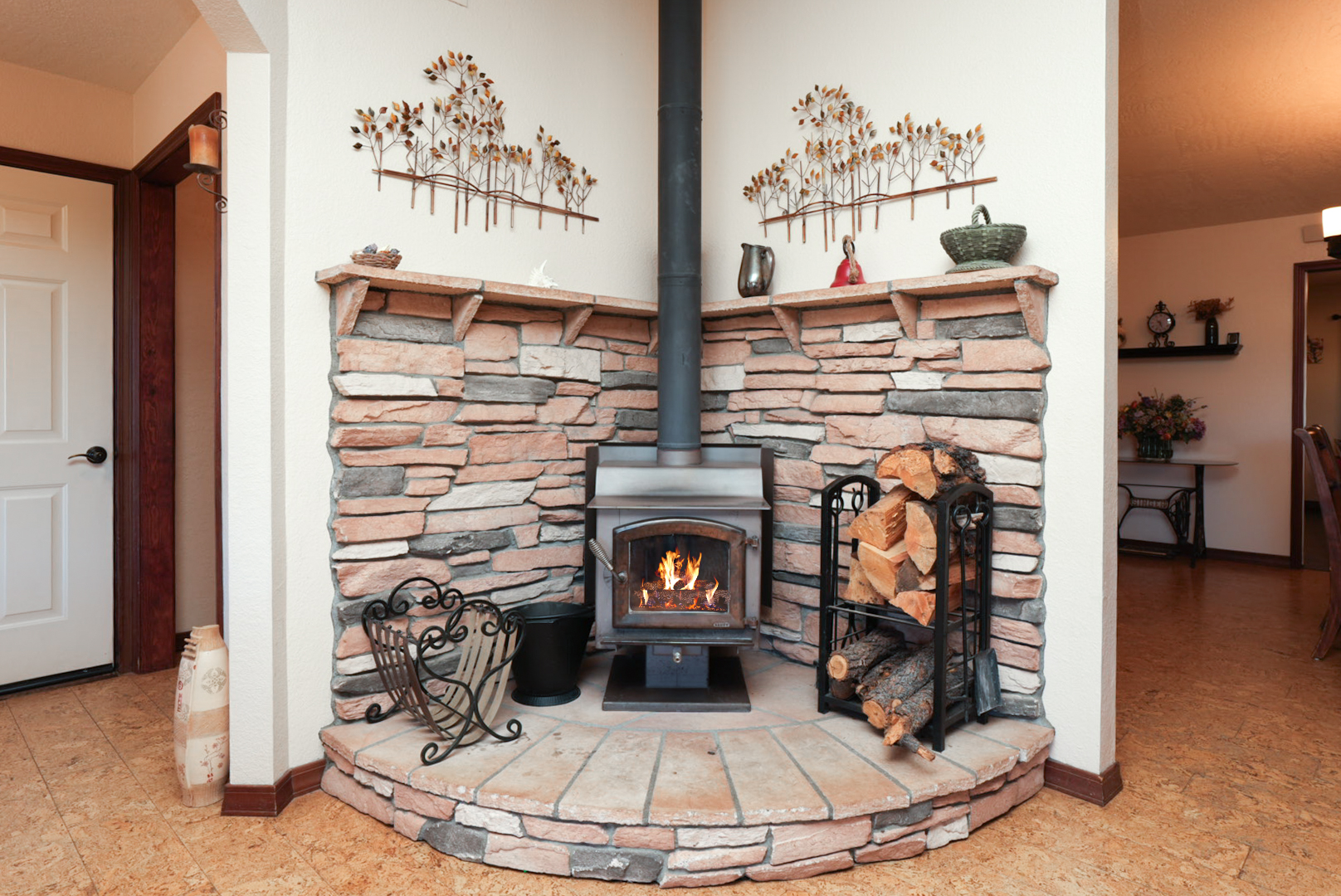 Cozy stone wood stove—perfect for chilly evenings, hot cocoa, and relaxing after a day of exploring.