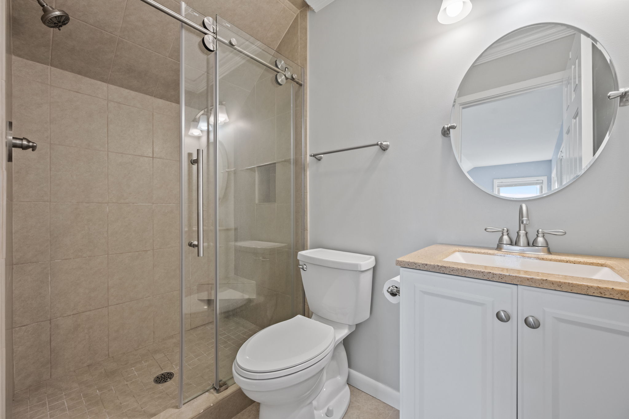 Ensuite bathroom offering a walk-in shower and single vanity
