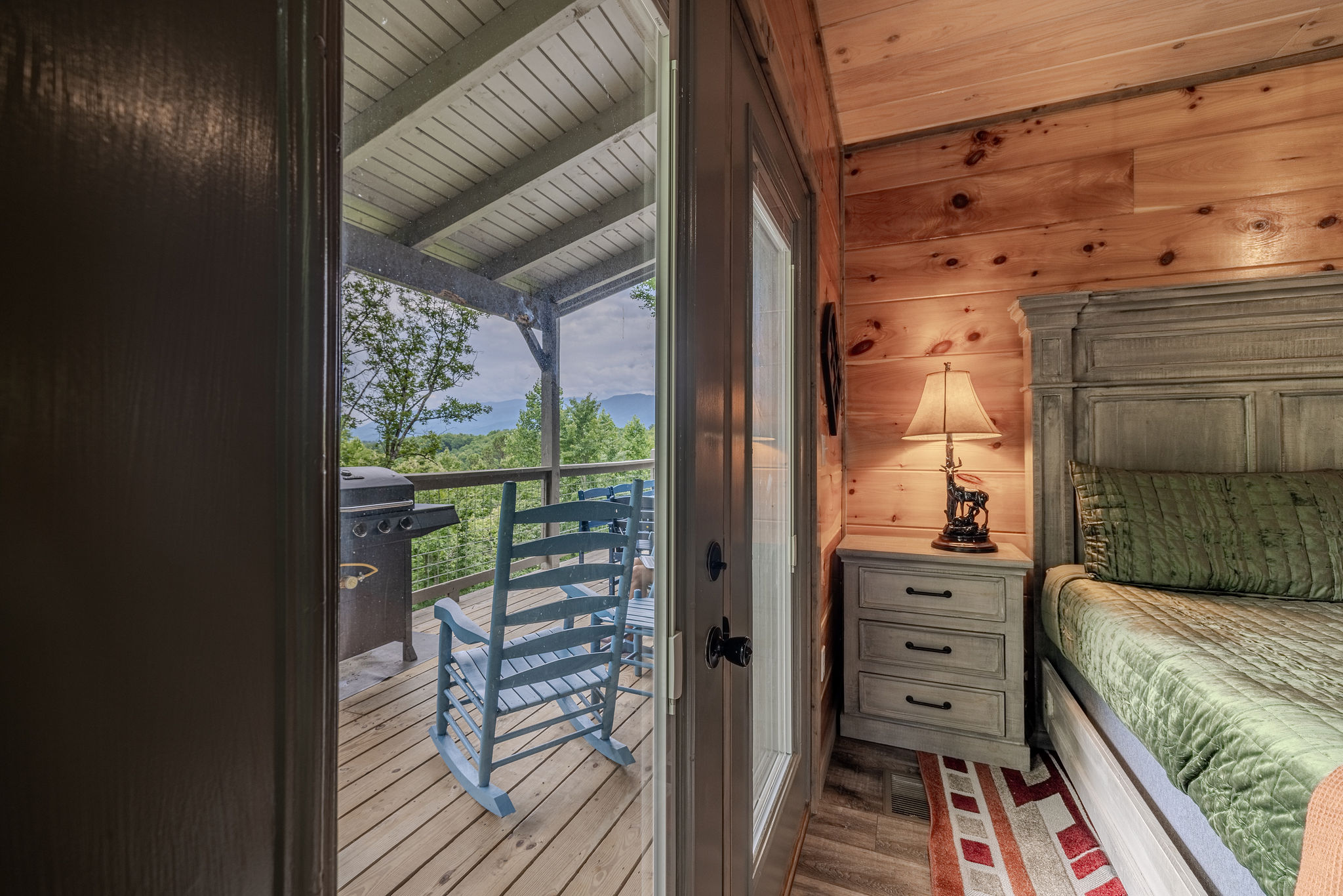 The Cartographer’s Suite gives guests convenient main-level sleeping space with easy access to the living room, kitchen, deck, and private bathroom.