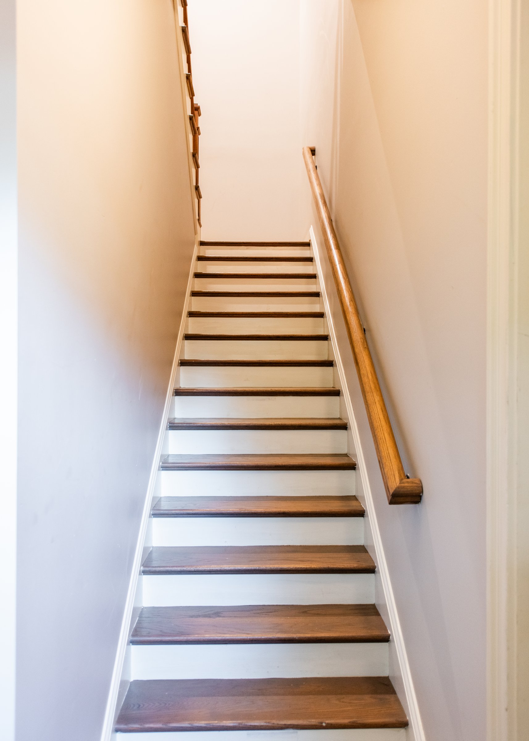 The staircase connecting the main living level to the bedrooms above.