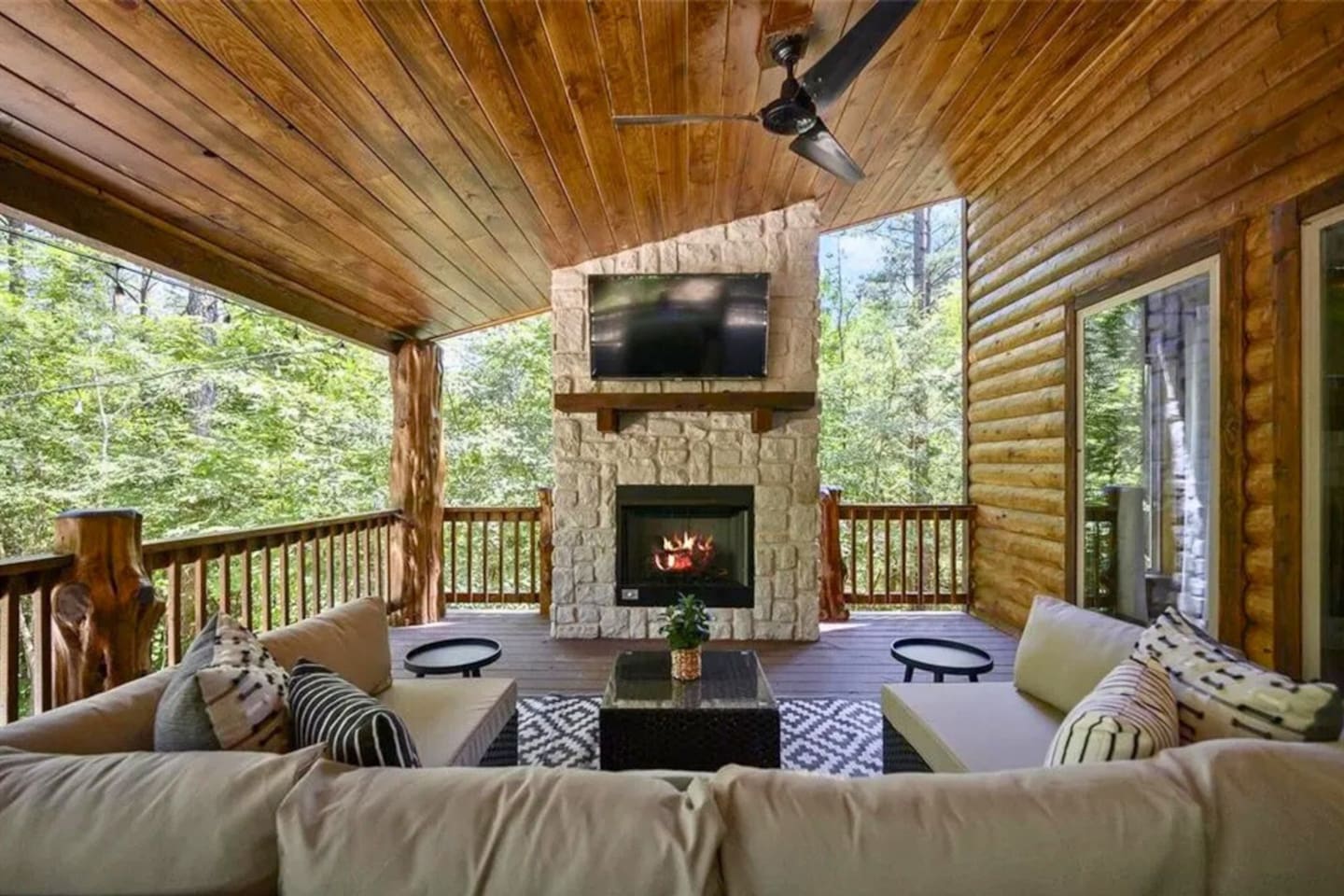 Gather with family and friends in the outdoor living space, featuring a cozy fireplace and comfy seating for evenings under the stars.