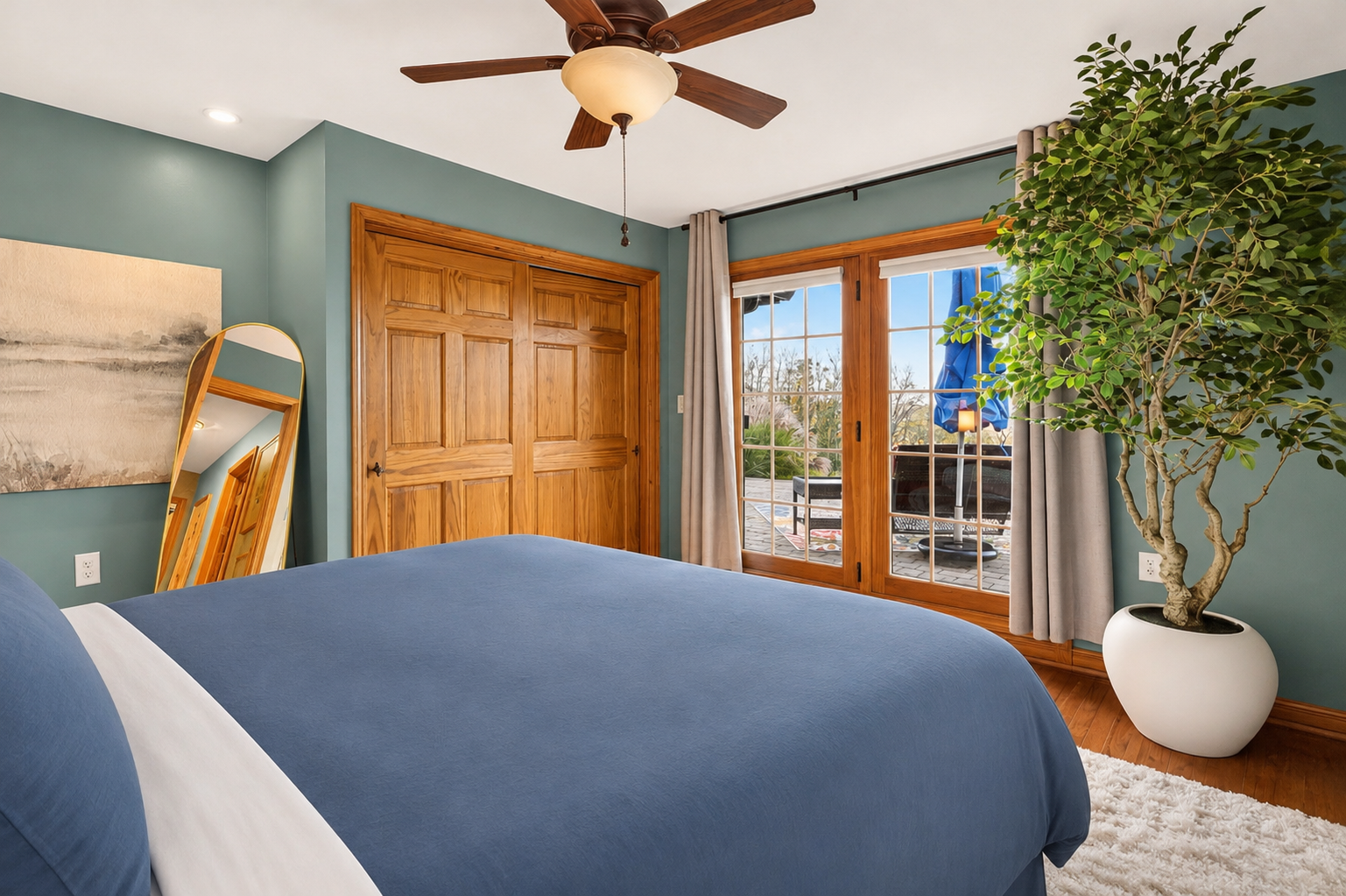 Bedroom 3 with glass doors opening to outdoor area