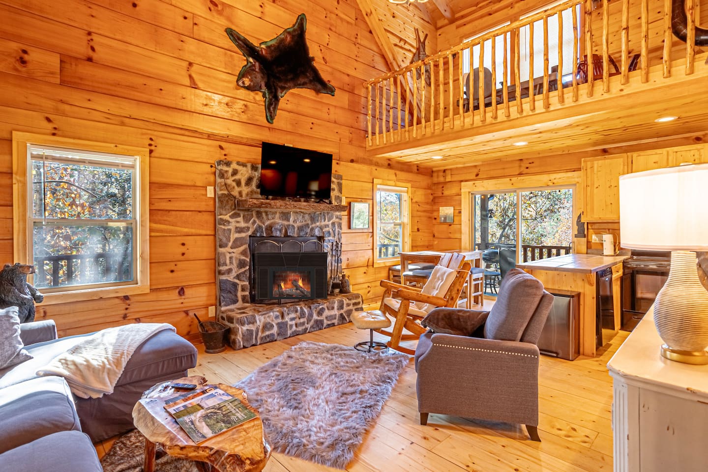 Very private 3 story log cabin overlooking French Broad River. Large open living room with exceptional views throughout the home