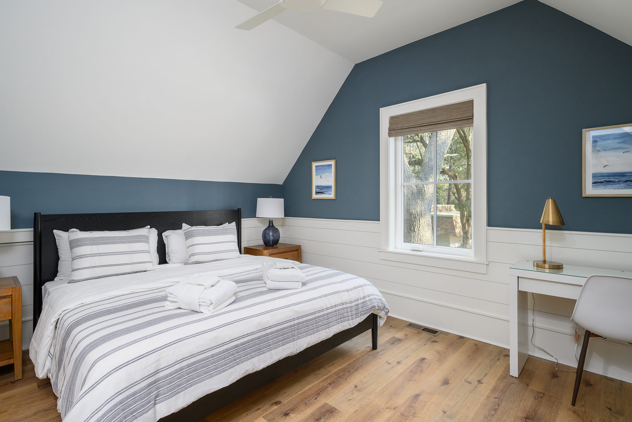 Bedroom over garage features king bed