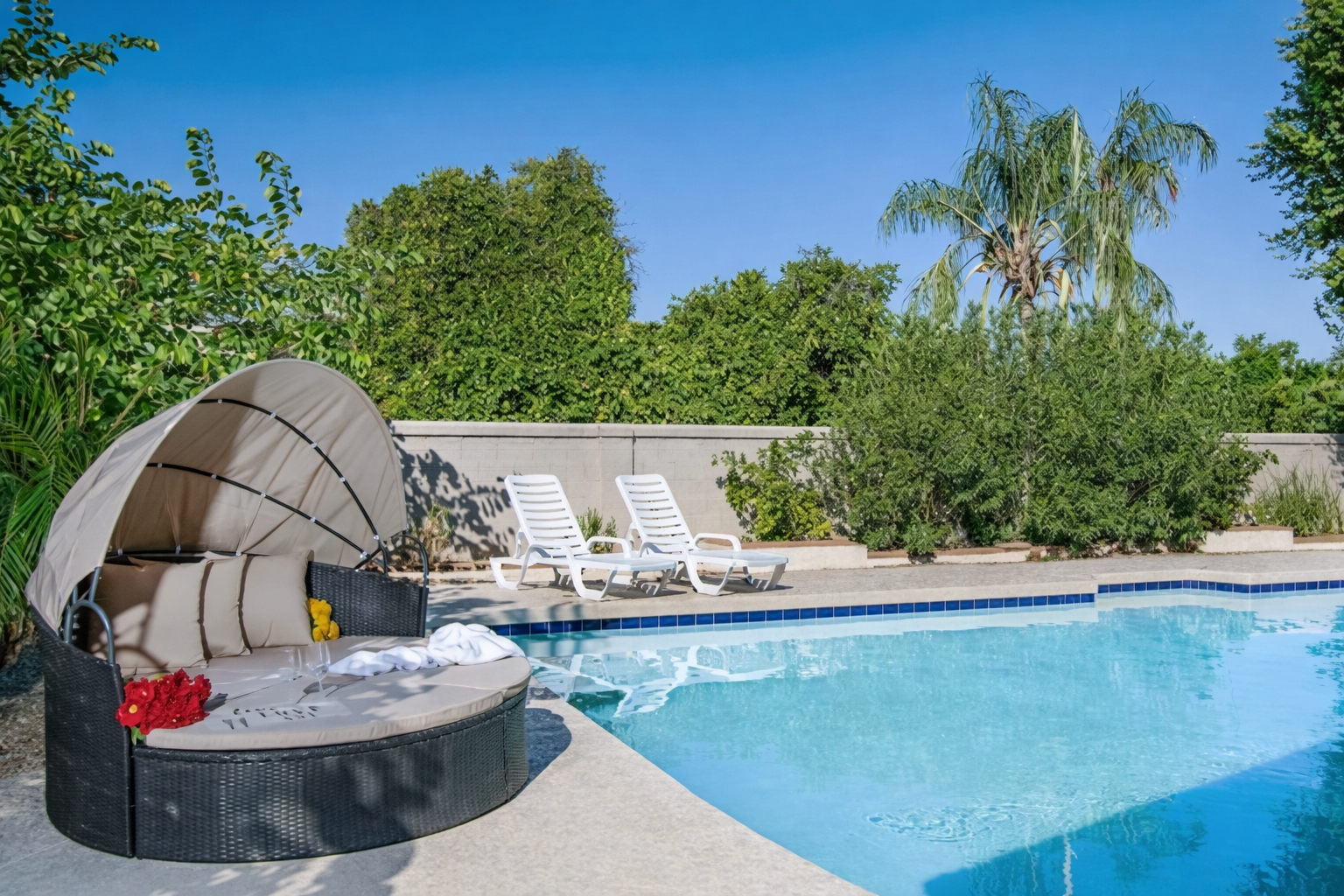 Soak up the sun or slip into the heated pool for a relaxing retreat surrounded by lush privacy and resort-style comfort.