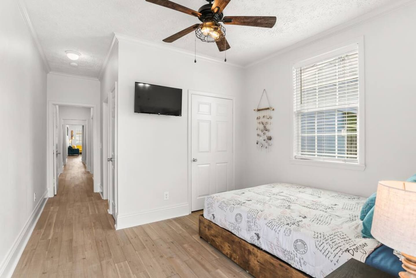 The private master bedroom has a closet for your luggage, a Roku TV, ceiling fan, and gorgeous wood floors (like the rest of the house)