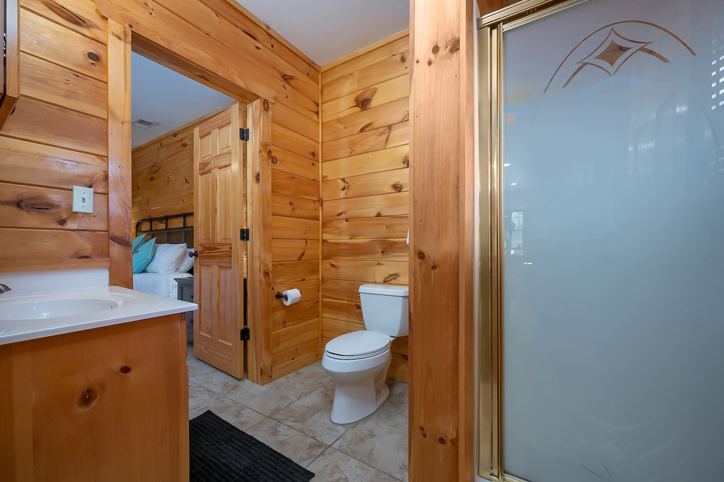 3rd bedroom located in lower level of cabin with access to shower
