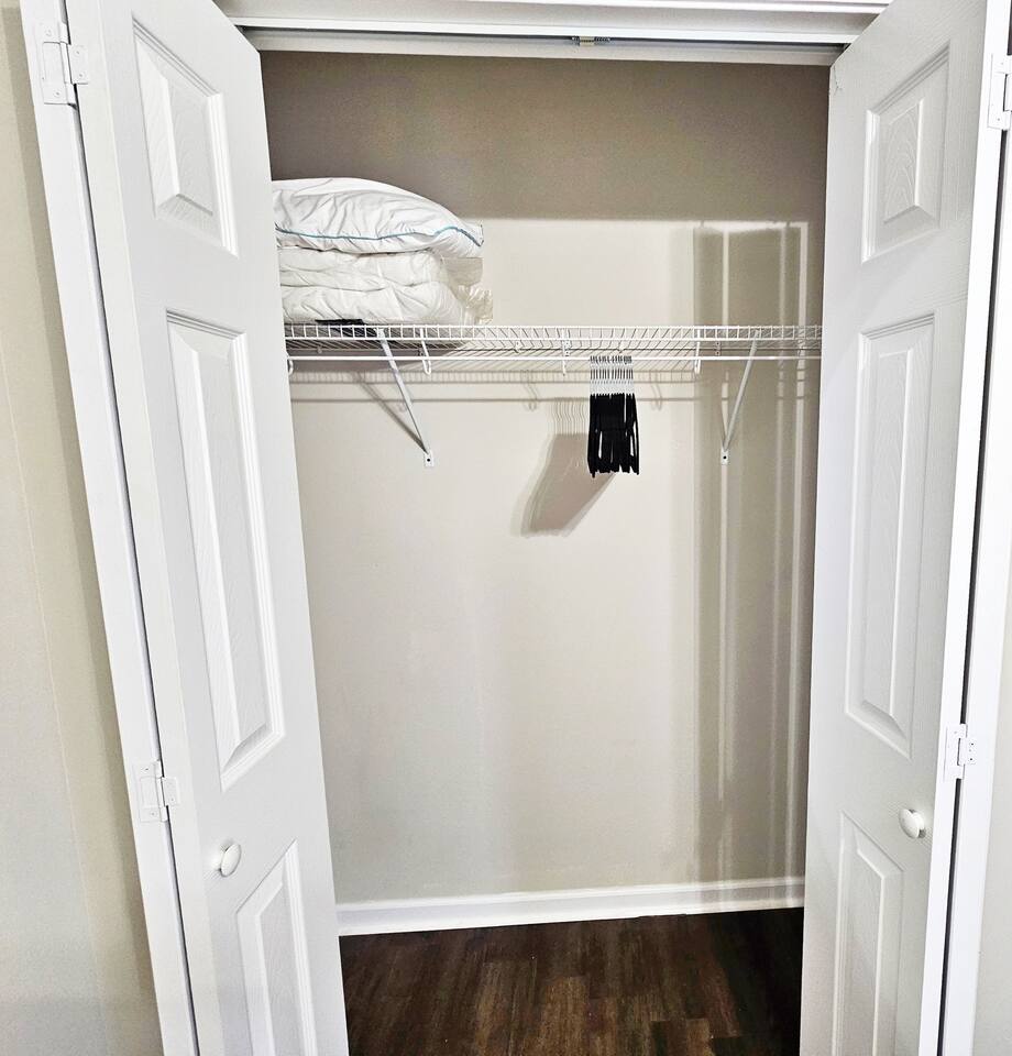 The closet has plenty of space for storage. You will find an extra pillow, blanket, set of linen, and hangers in the closet.