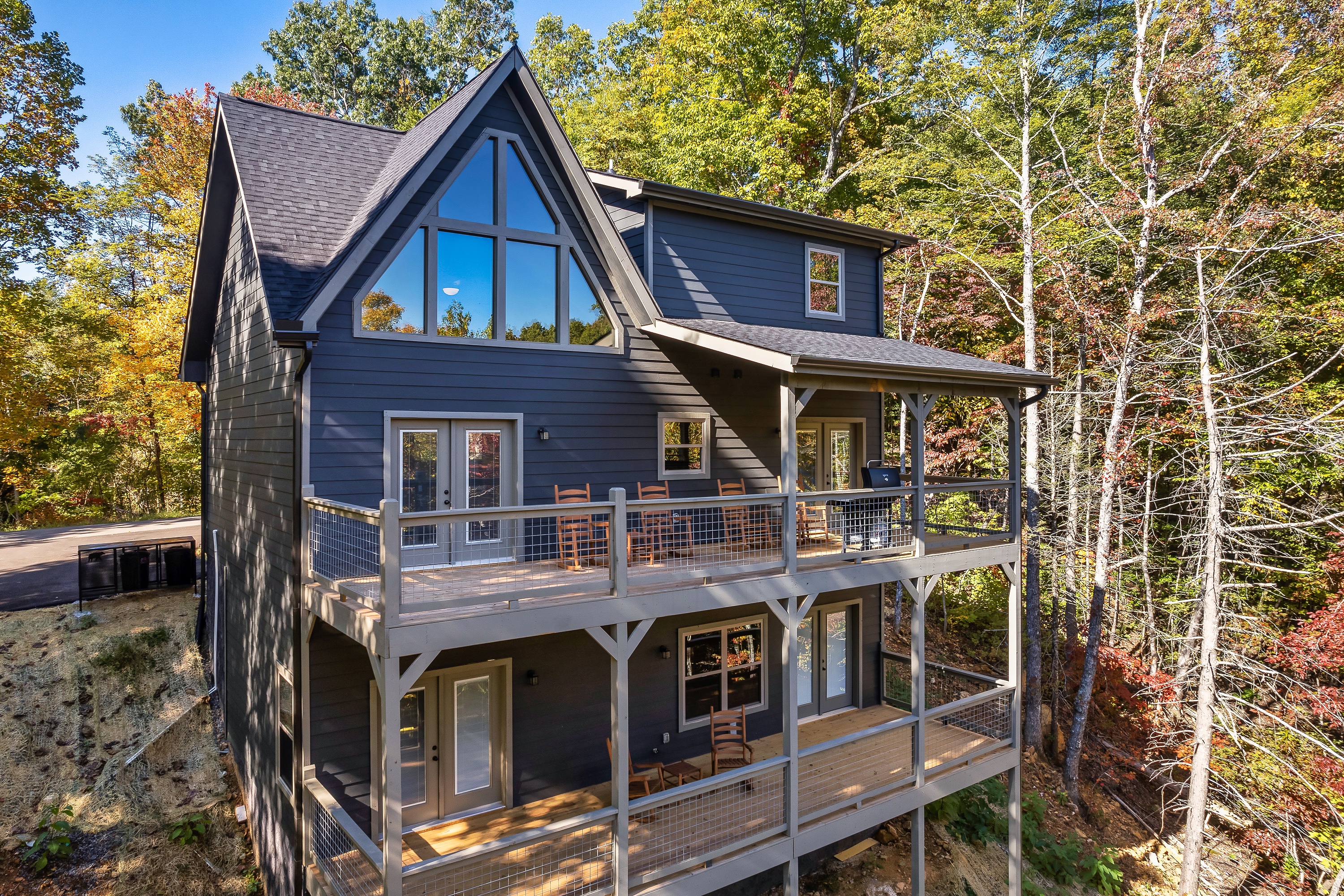Two spacious covered decks overlook the cabin’s quiet mountain setting.