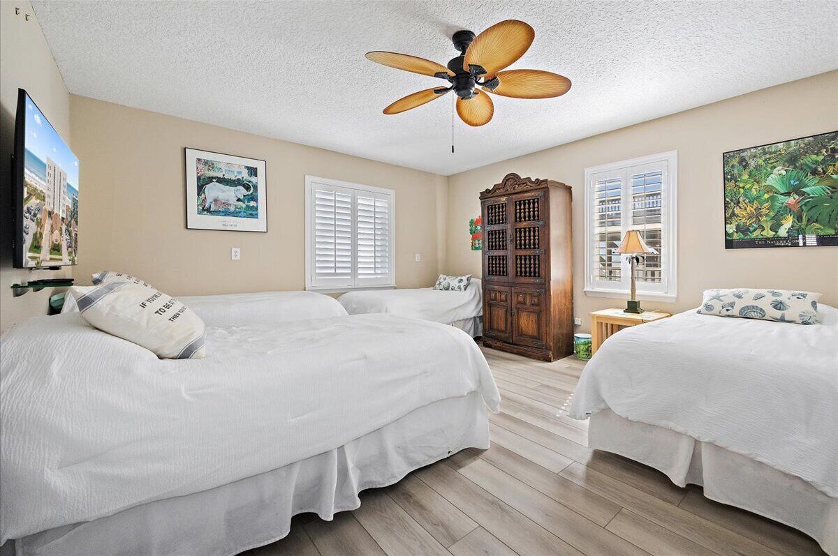 Bunk room downstairs with four twin beds