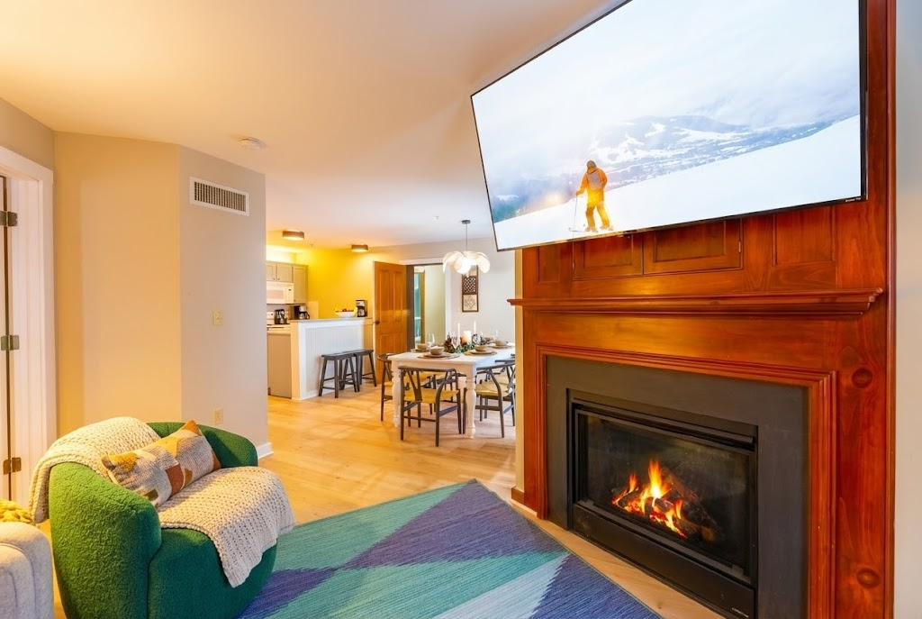 Enjoy the warmth of the fireplace in this spacious living room.