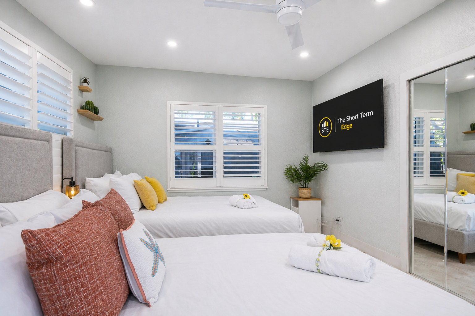 Two queen beds and straight out to the backyard — comfort meets fresh air 🌿- equipped w/ a Smart TV