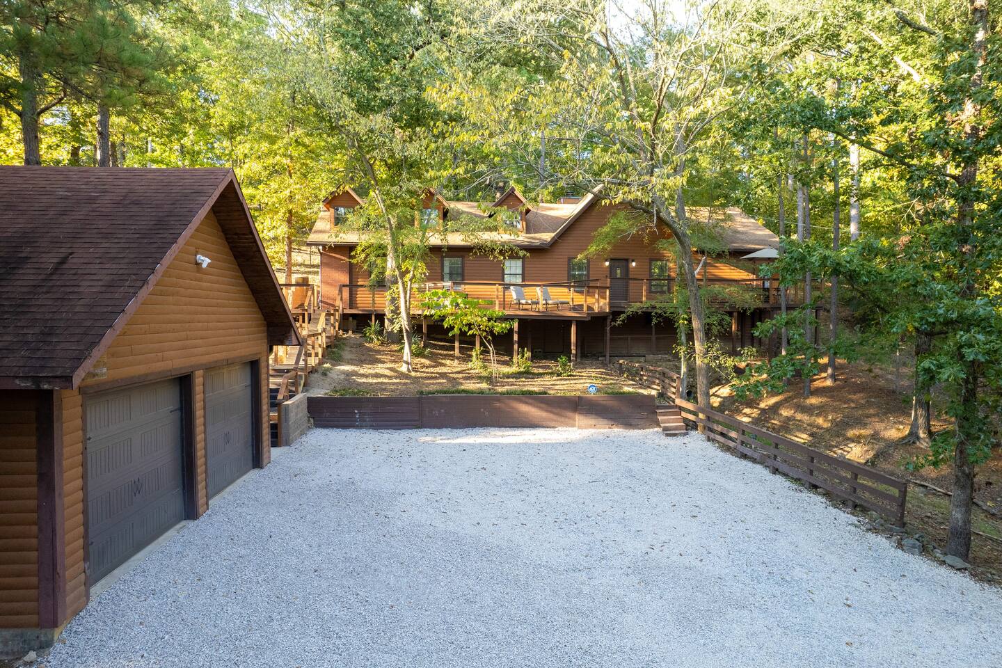 Large lower parking area has lighted stair access to front wrap around deck and both entrances. 