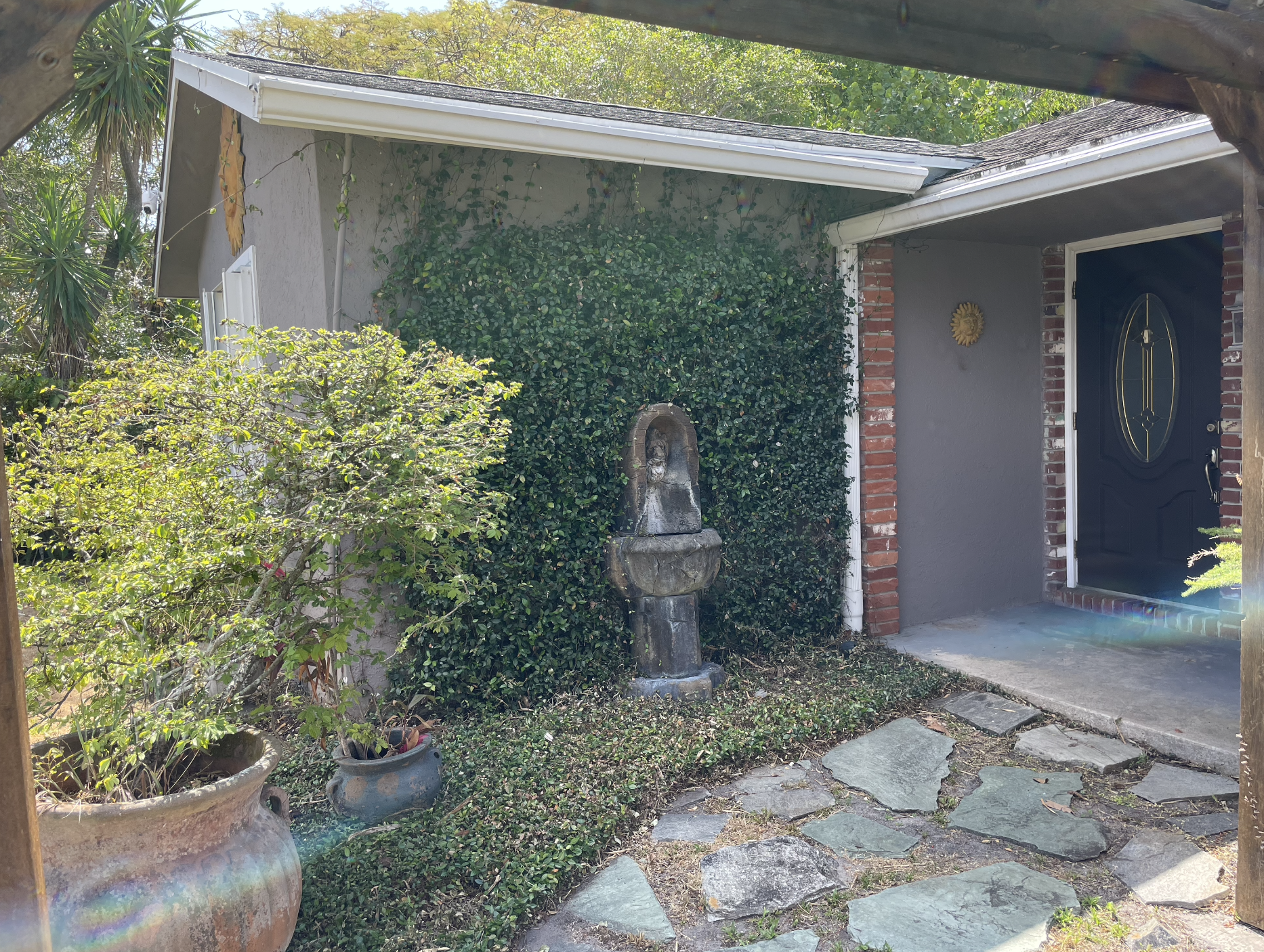 Enjoy time outside under the pergola, surrounded by a garden and fountains.