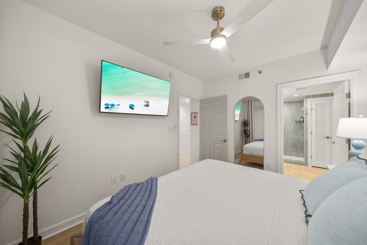 New on-suite bathroom connects to primary bedroom.  Full length mirror and closet behind bedroom door