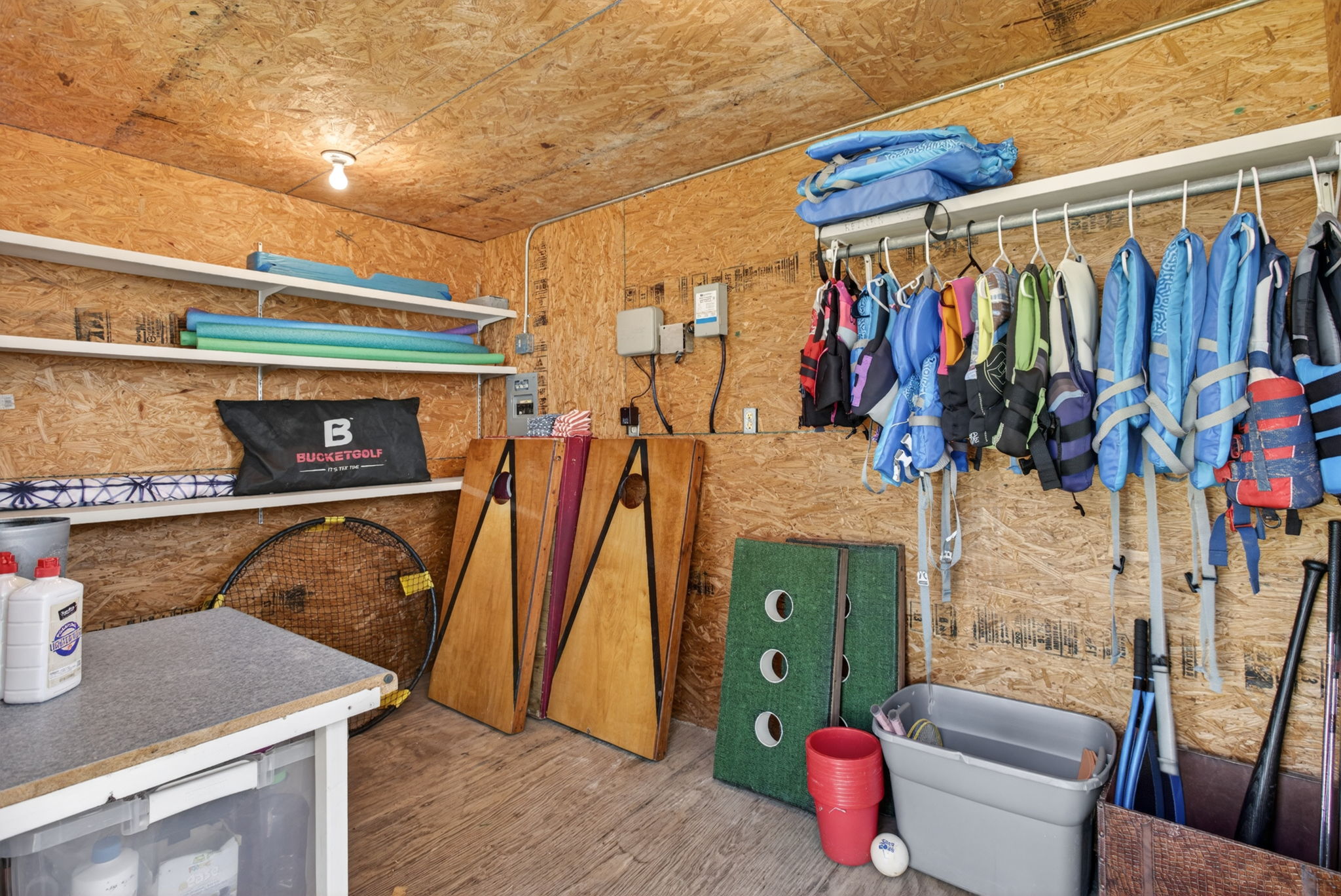 Outdoor Storage Building with life jackets and games 