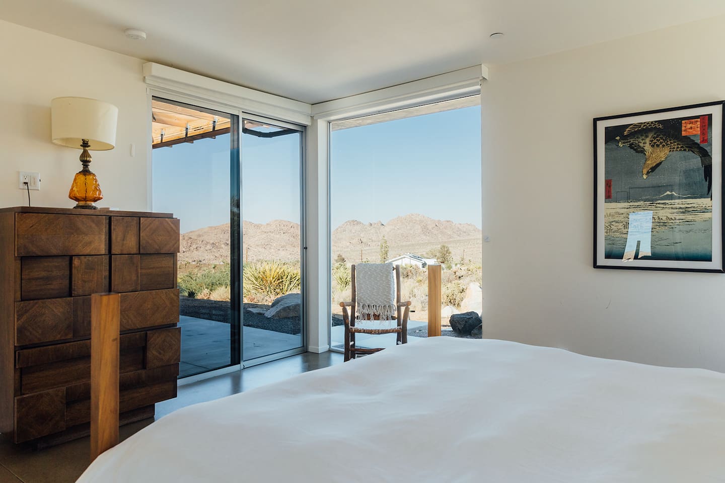Wake up to mountain views and step outside through sliding doors that connect the bedroom directly to the patio.