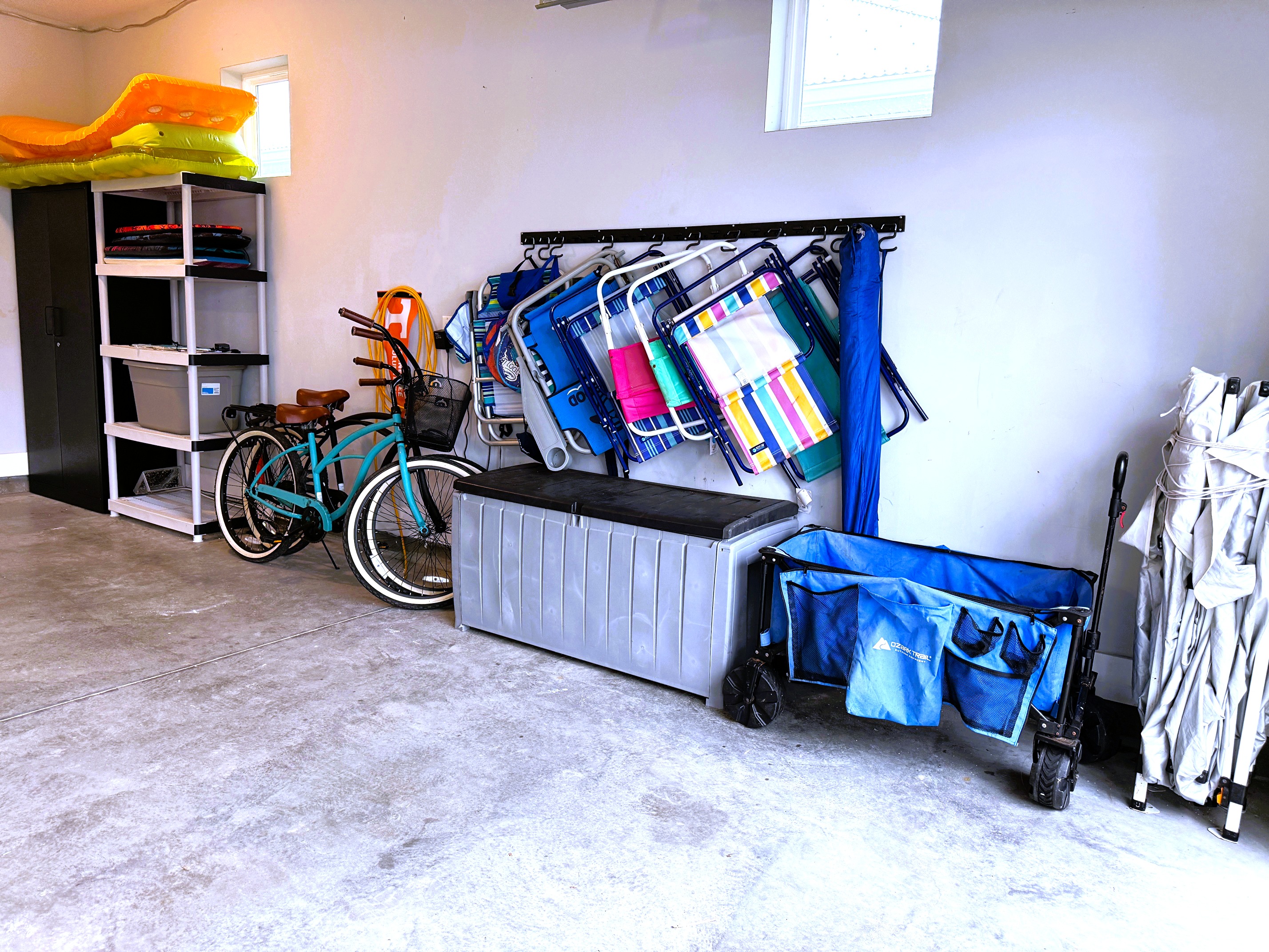 Beach equipment including bikes, chairs, umbrella, snorkelling gear and boogie boards
