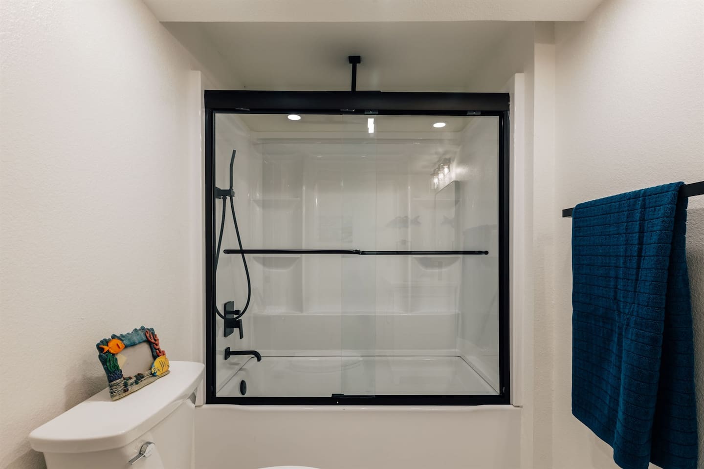 Transform your daily routine into a retreat in our full bathroom, featuring a luxurious rain shower.