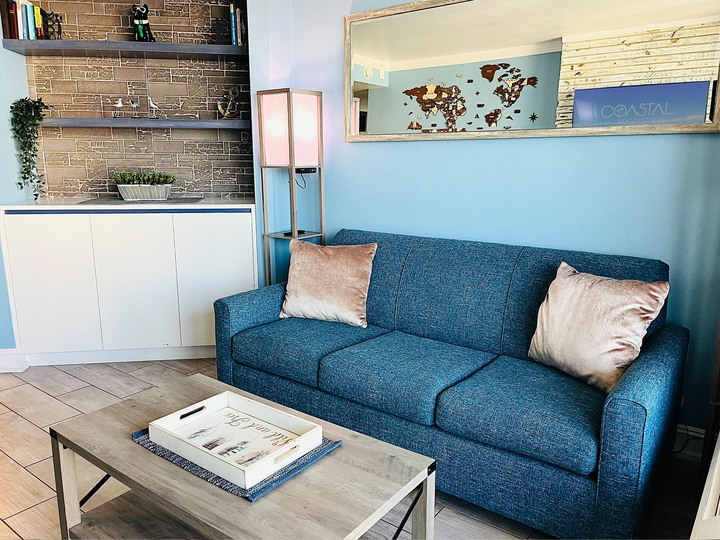 Step into our inviting living room space, where every moment is infused with warmth and relaxation.