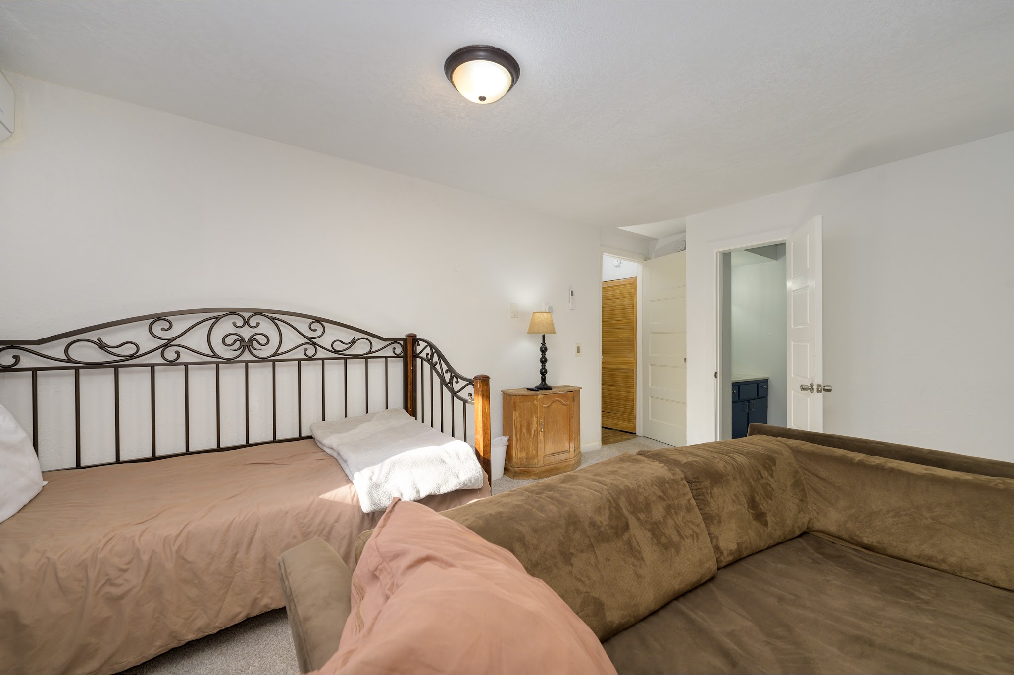 Bedroom with a sofa for extra lounging
