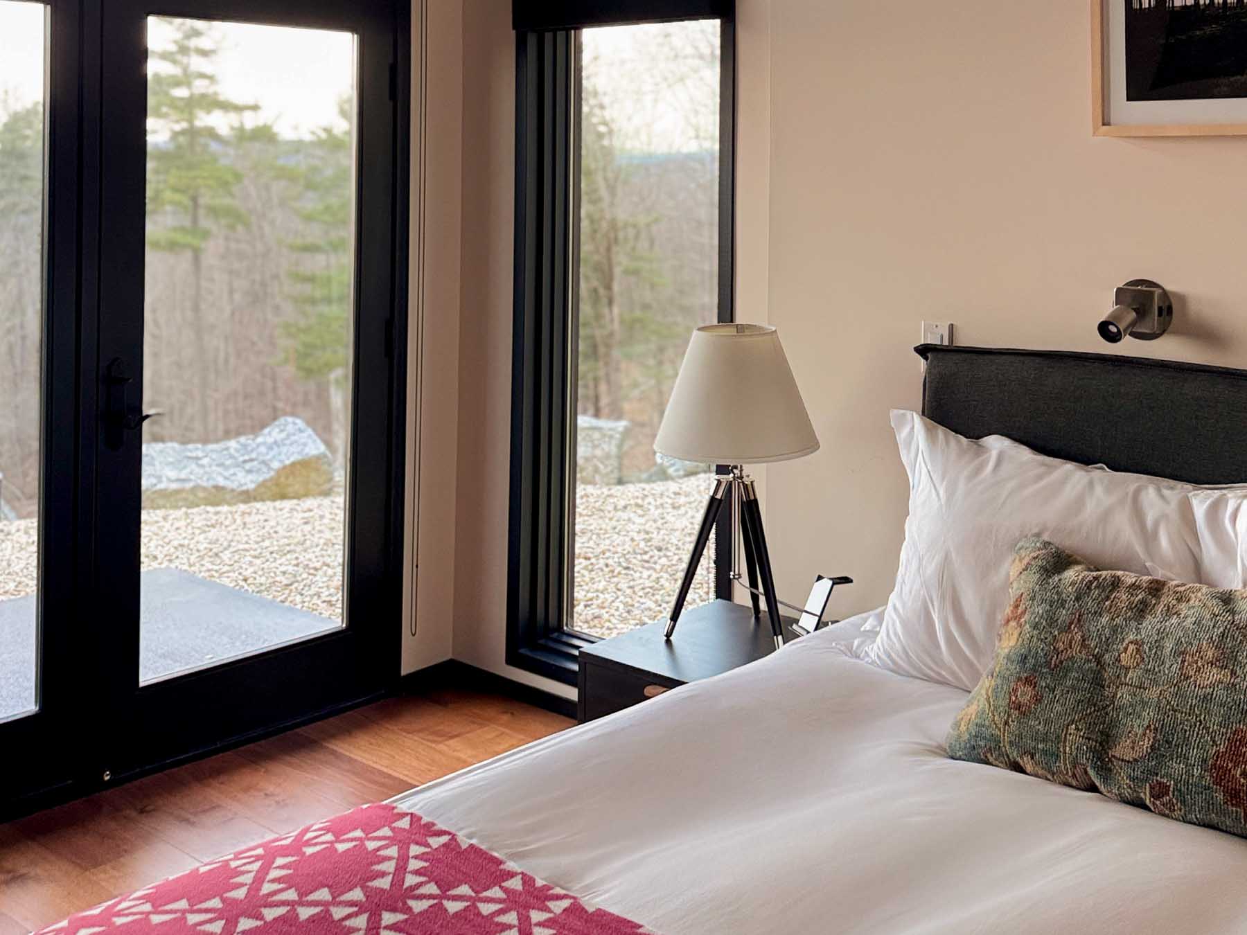 Bedroom Four at Sunset Falls &mdash; glass door, terrace beyond the headboard