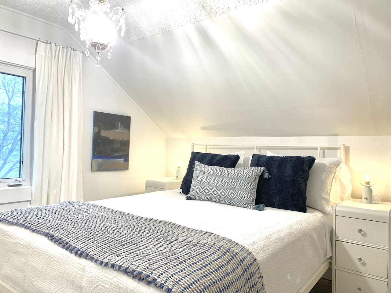 Bright Primary Bedroom with Quality Bedding
Sunny and relaxing primary bedroom. Comfortable mattress and calming décor make this room a guest favorite.