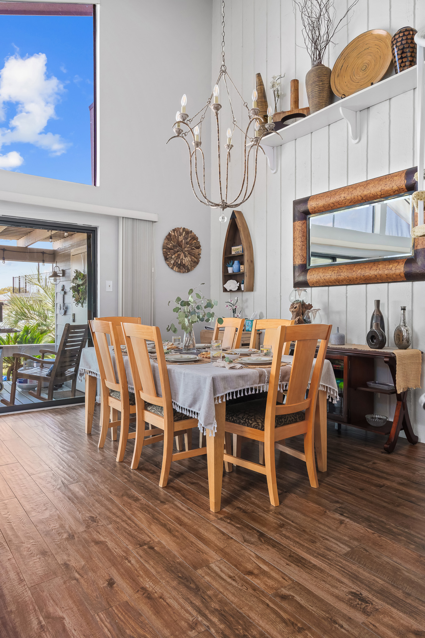 Dine under soaring ceilings and natural light in this thoughtfully styled space, where lake-inspired decor meets cozy charm. When it’s cool outside, slide open the doors to let in the breeze and enjoy a meal that flows effortlessly from indoors to out.