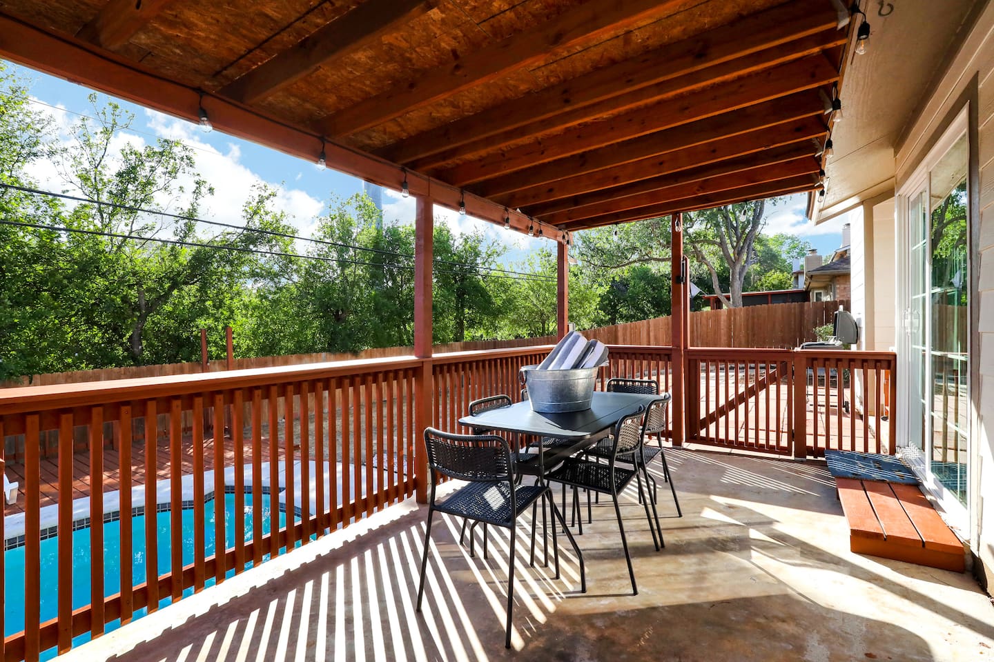Deck with seating overlooking pool
