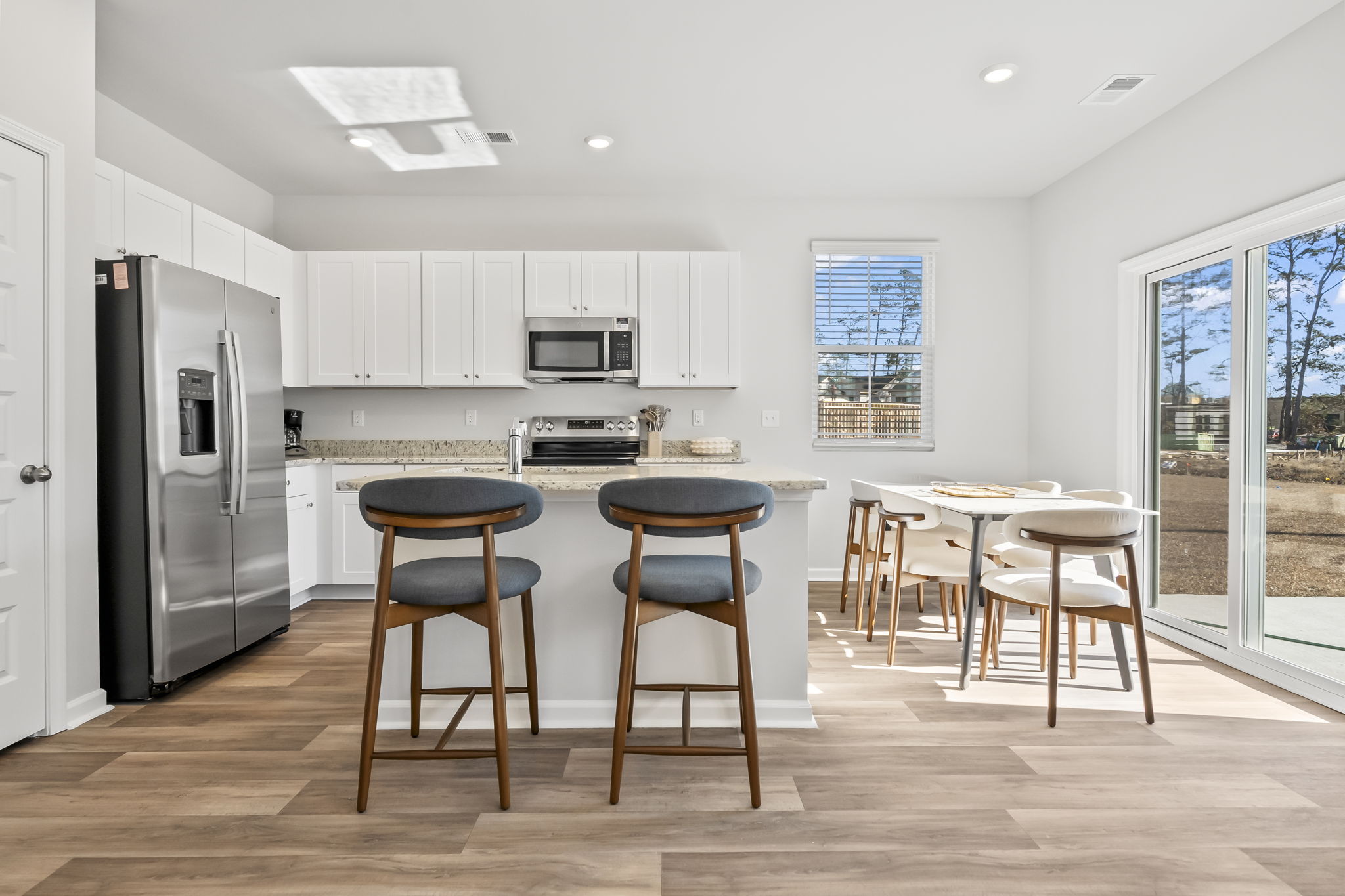 Kitchen with dining table that seats 6