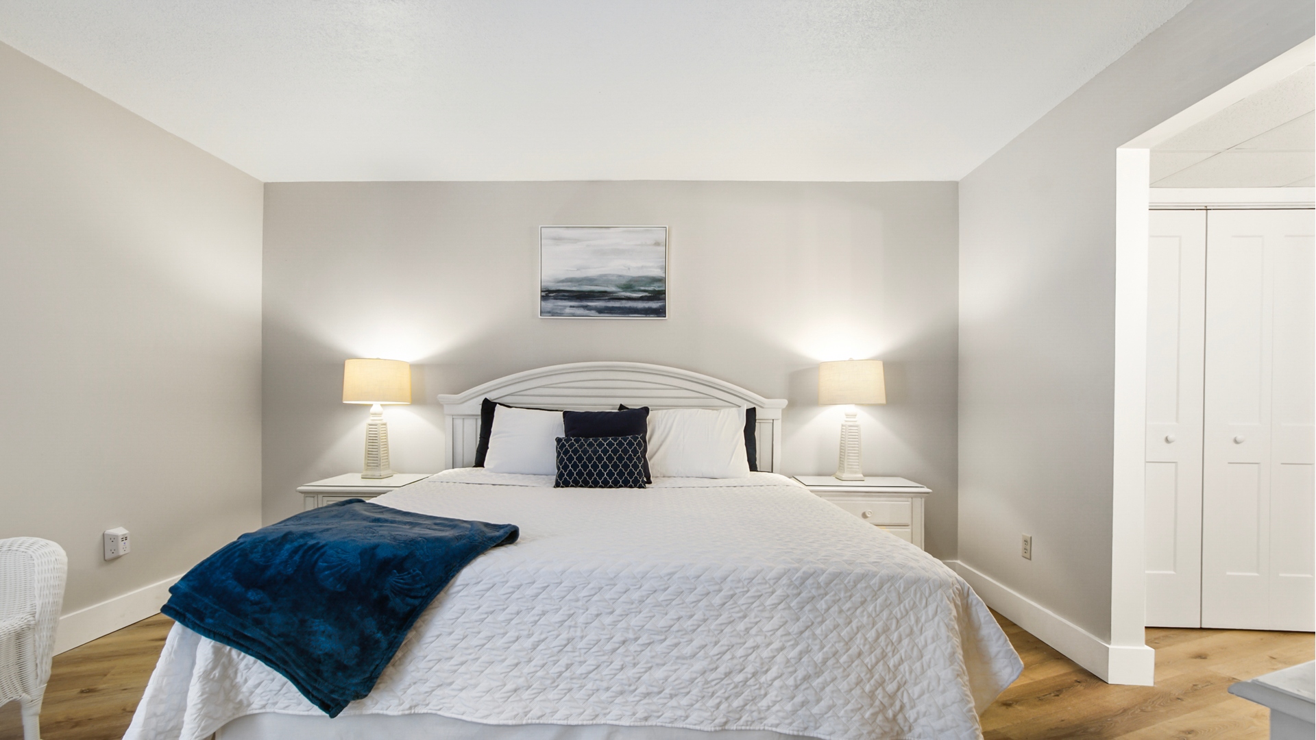 Main bedroom with king bed, ensuite bathroom, smart TV and clothing storage