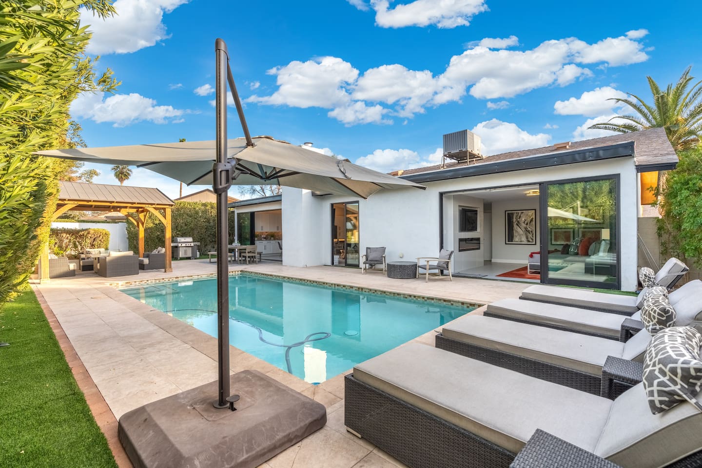 Soak up the sun by the sparkling pool, surrounded by high-end loungers and umbrellas for ultimate relaxation.